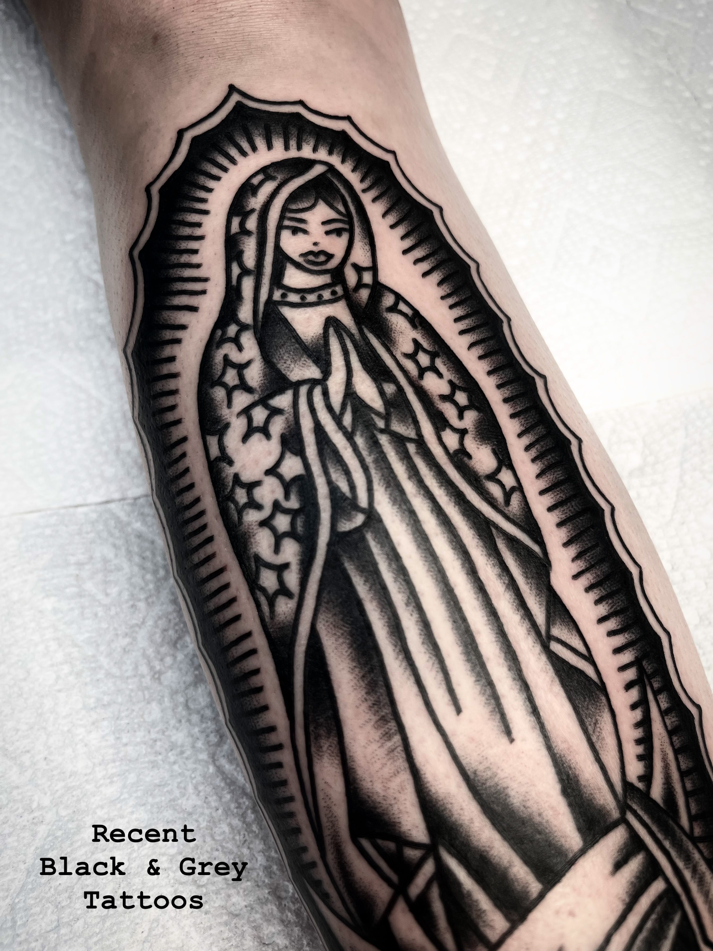 Our Lady of Guadalupe black and grey tattoo on the forearm by Victoria Lagano NYC Traditional Tattoos