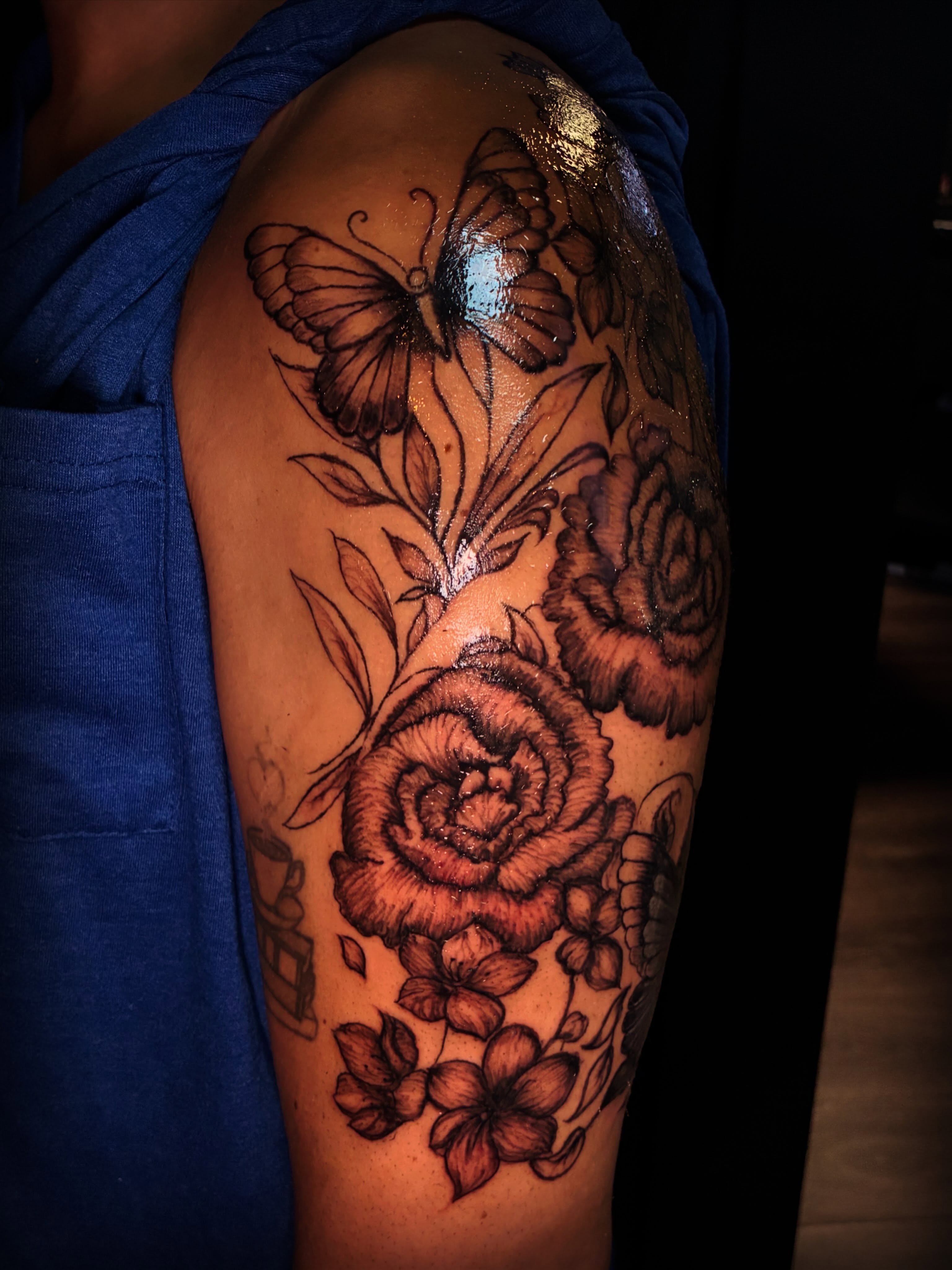 Roses and butterfly realism tattoo on the upper arm by Ink’d by Reina 🖤, Colorado Springs, Colorado