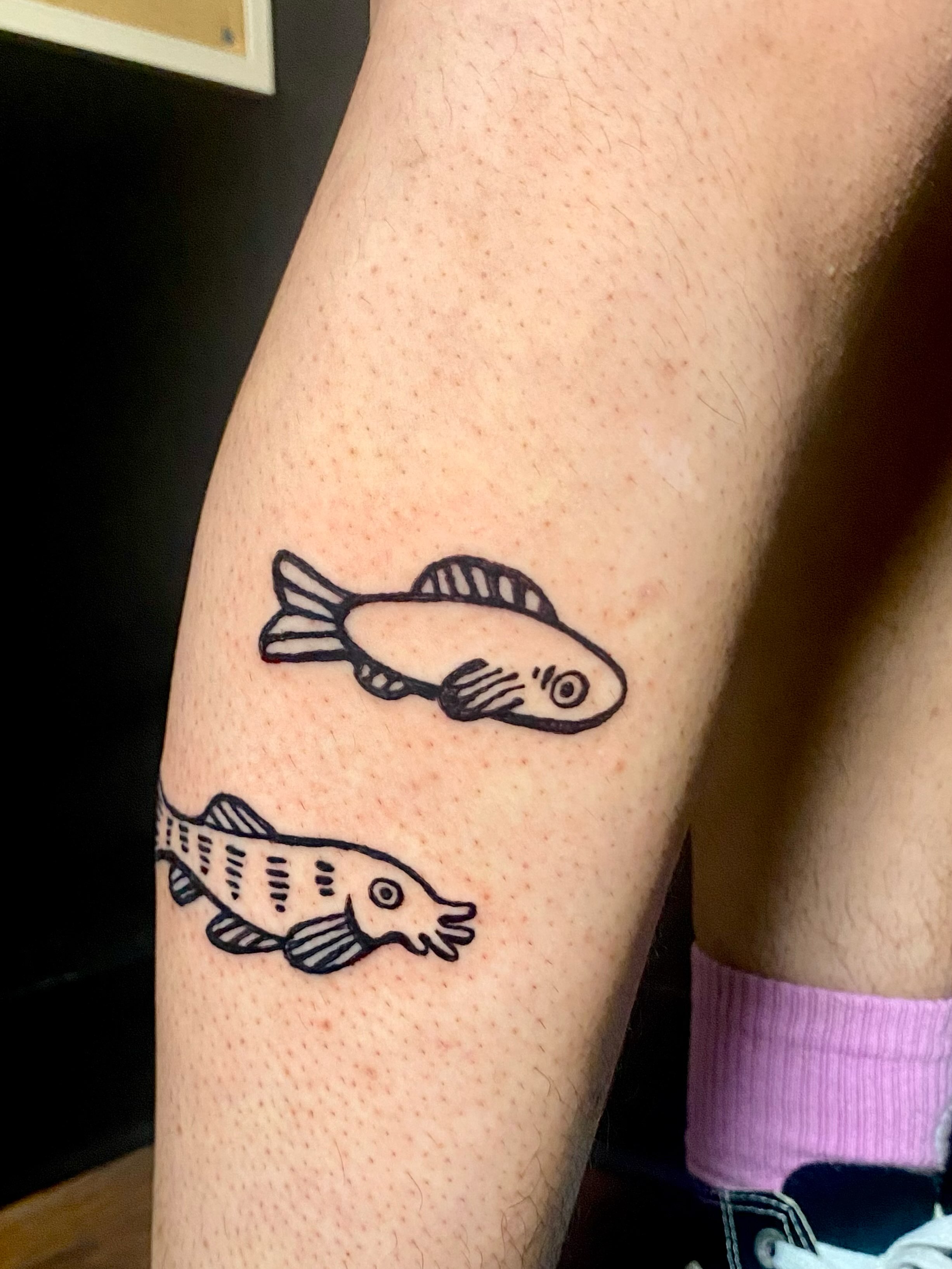 Fish minimalist tattoo on the forearm by ollie, Portland, Oregon