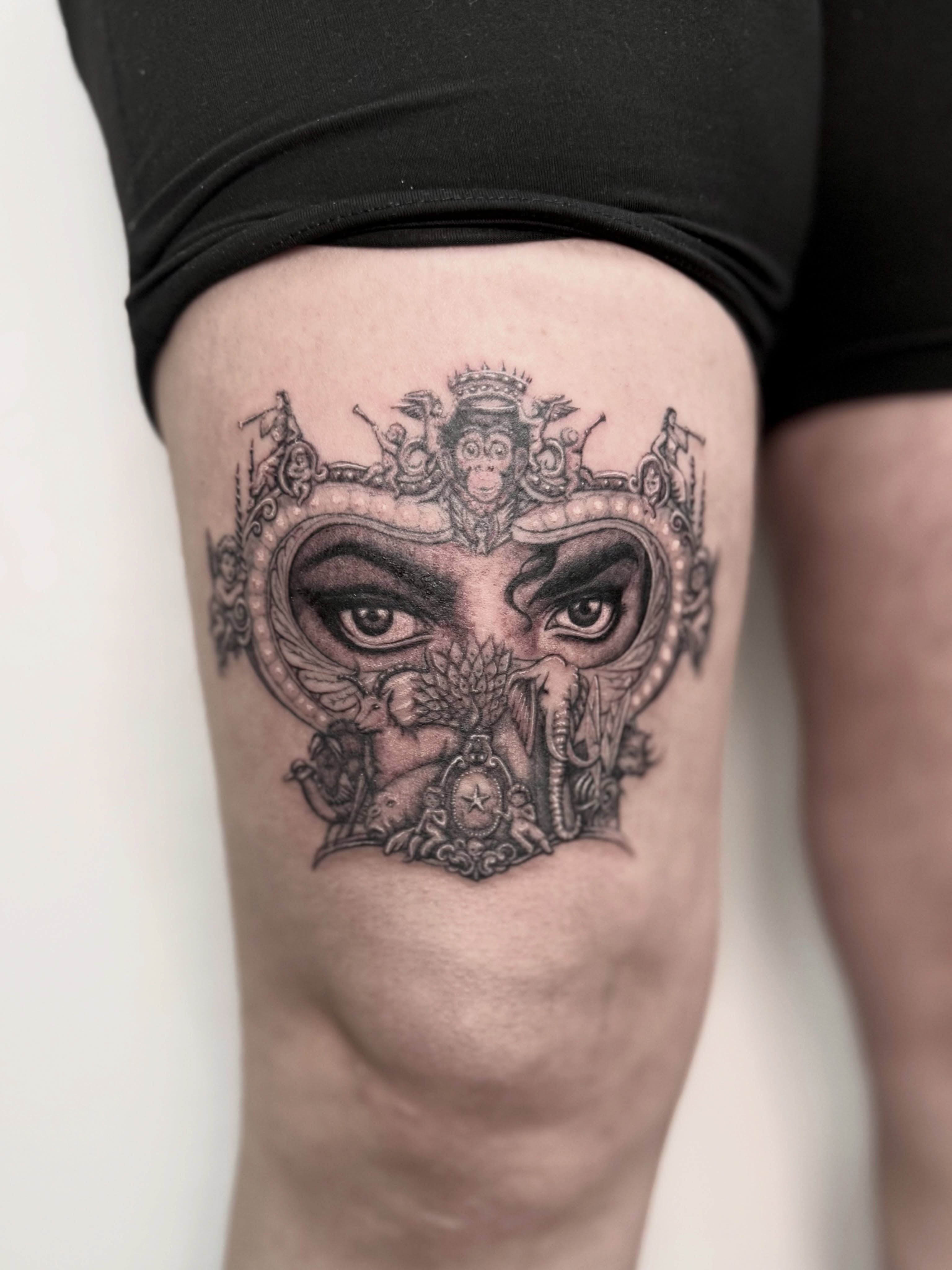 Mask realism tattoo on the thigh by Miro Ink Tattoo
