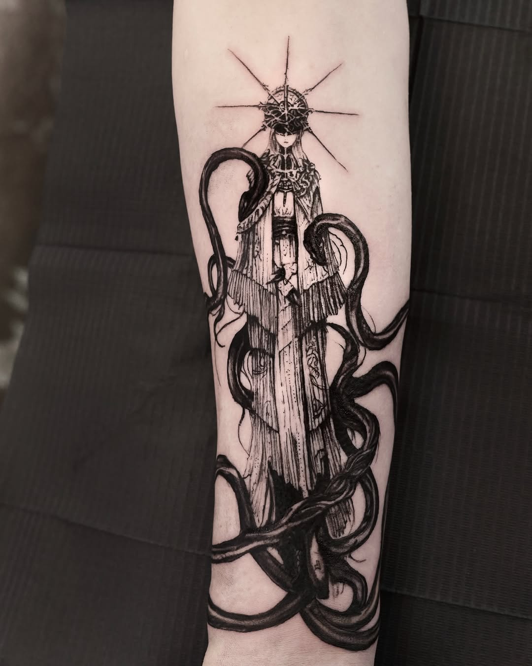 Female figure with snakes dark realism tattoo on the forearm by Gun