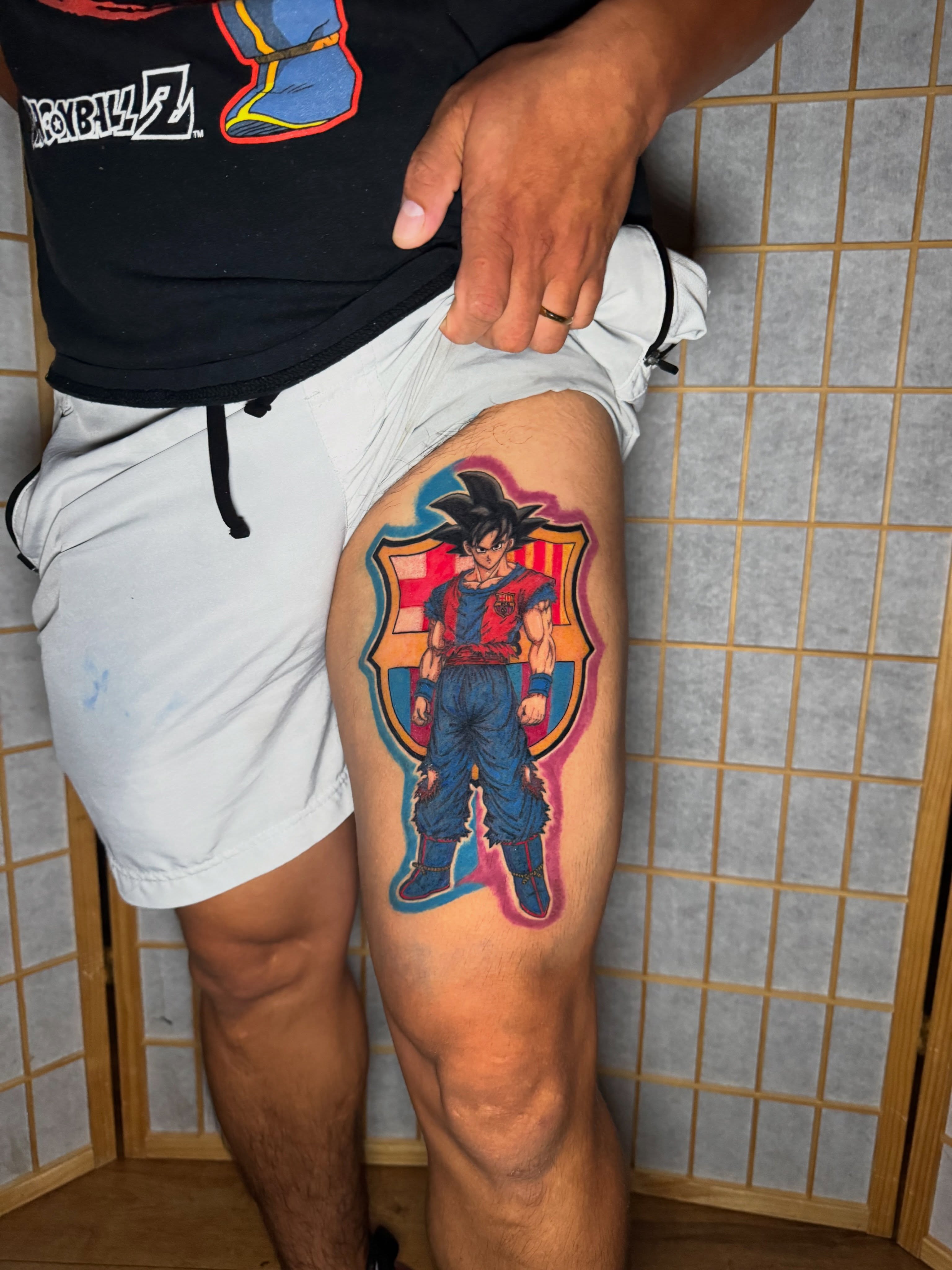 Son goku anime tattoo on the thigh by Ink Napawong