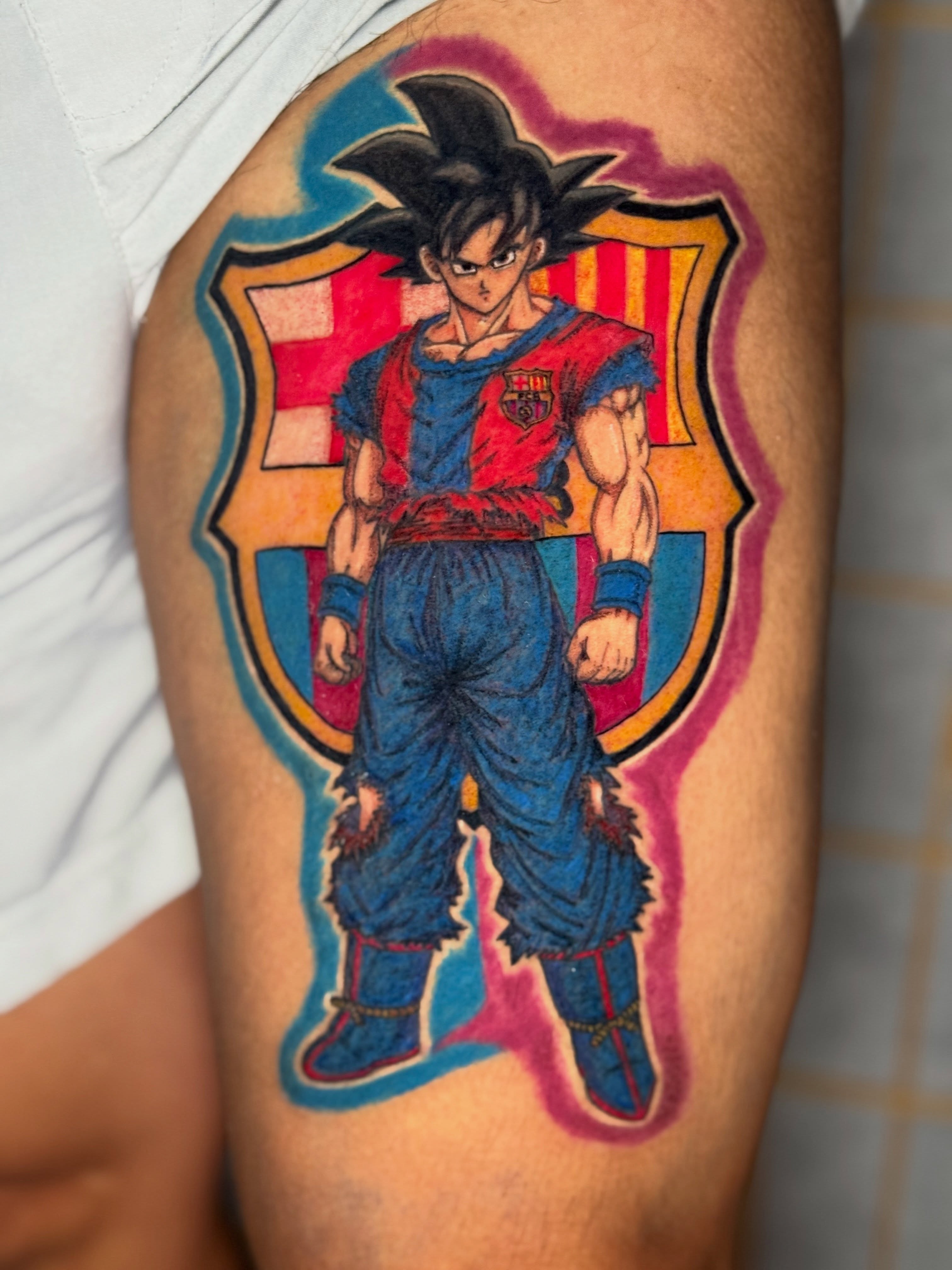 Son goku anime tattoo on the thigh by Ink Napawong