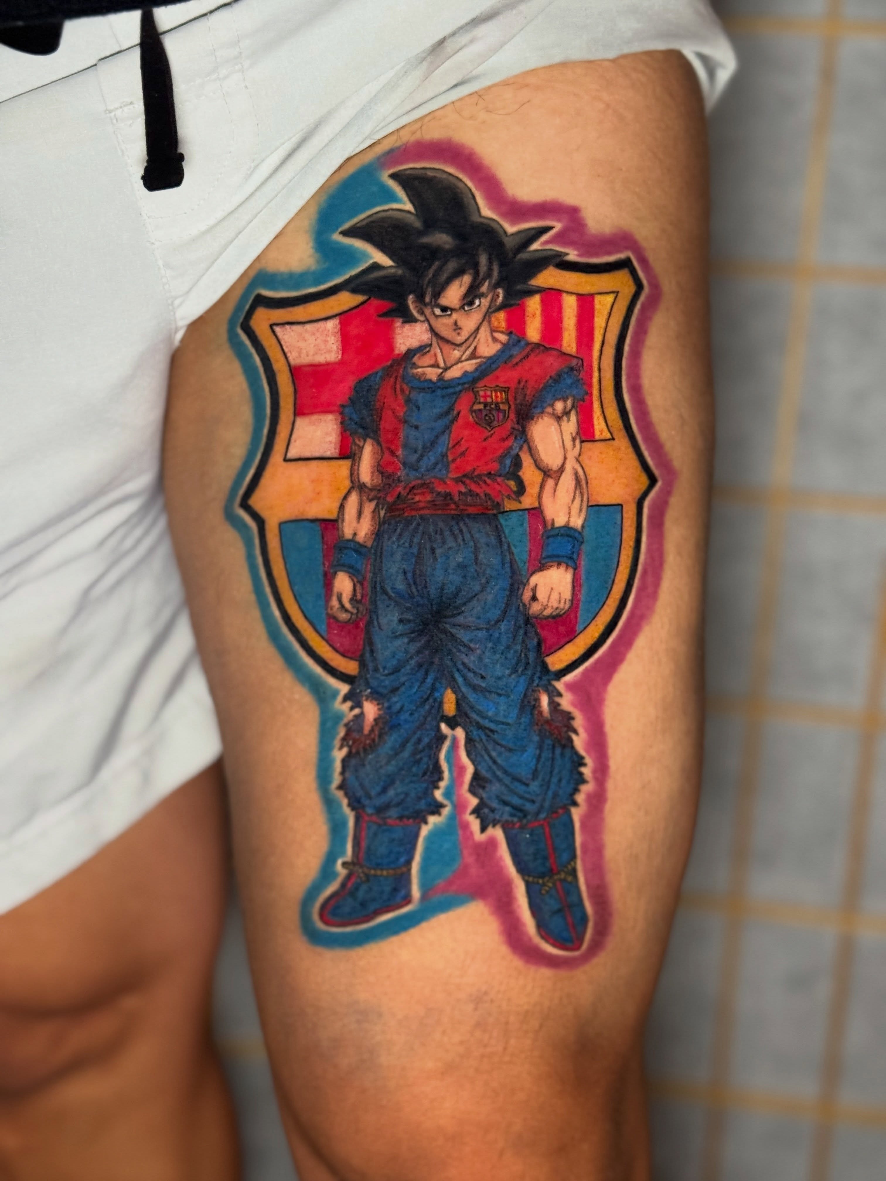 Son goku anime tattoo on the thigh by Ink Napawong