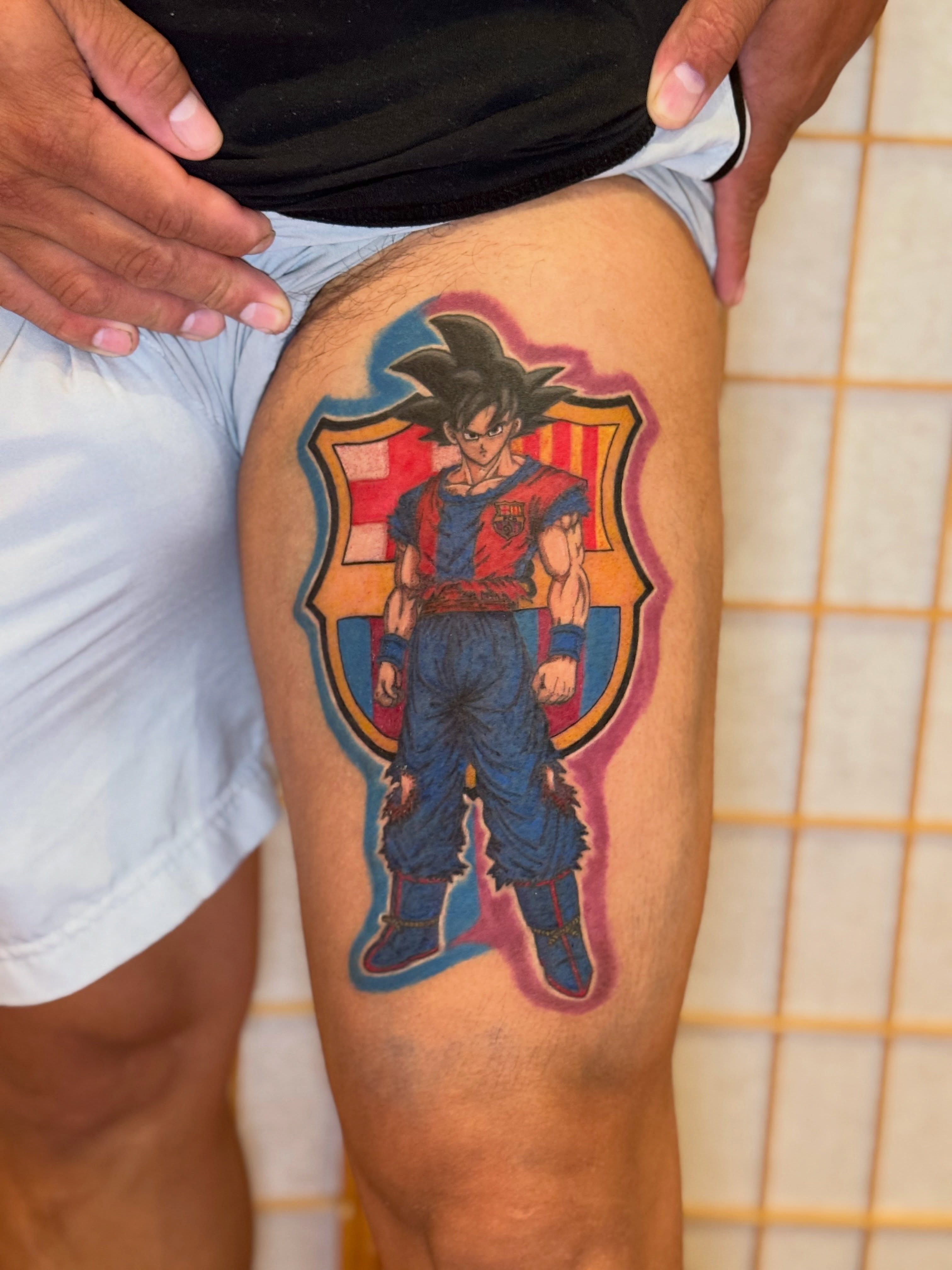 Son goku anime tattoo on the thigh by Ink Napawong