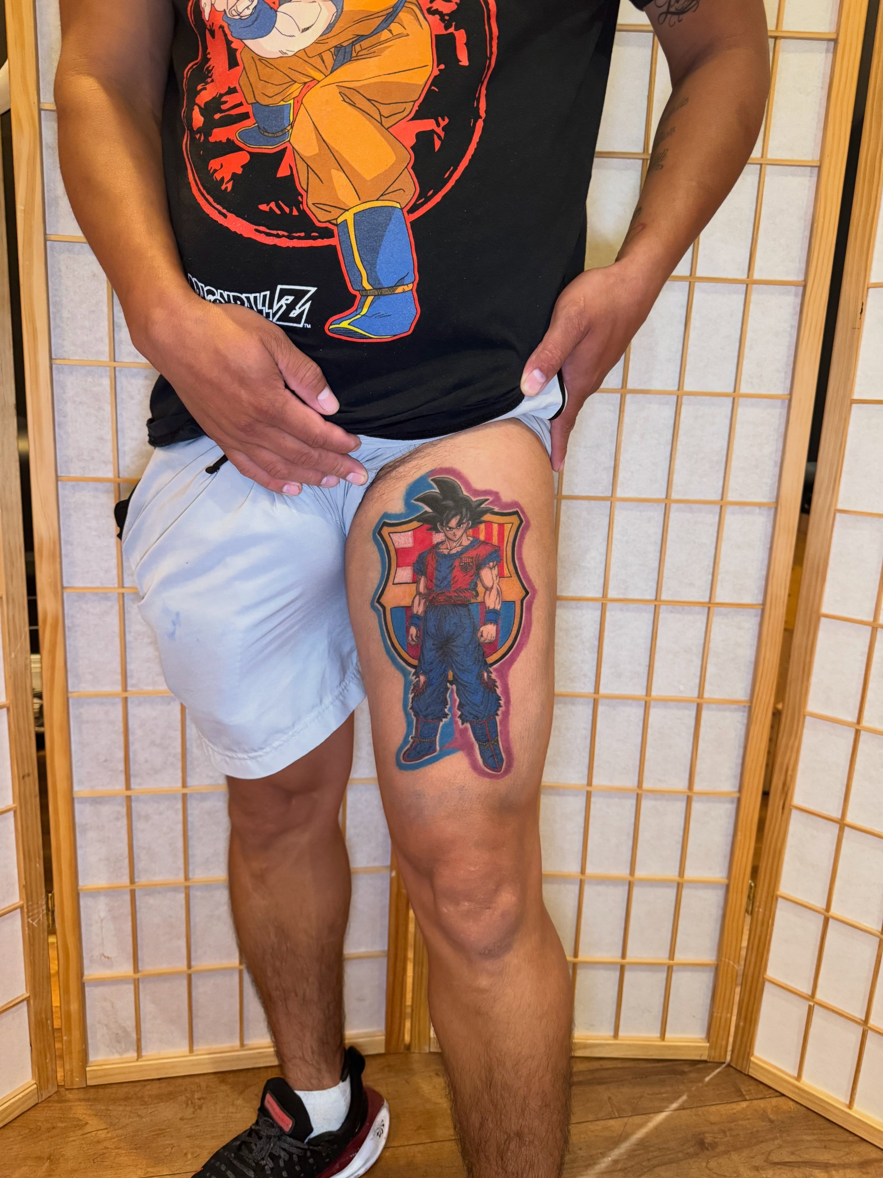 Goku anime tattoo on the thigh by Ink Napawong
