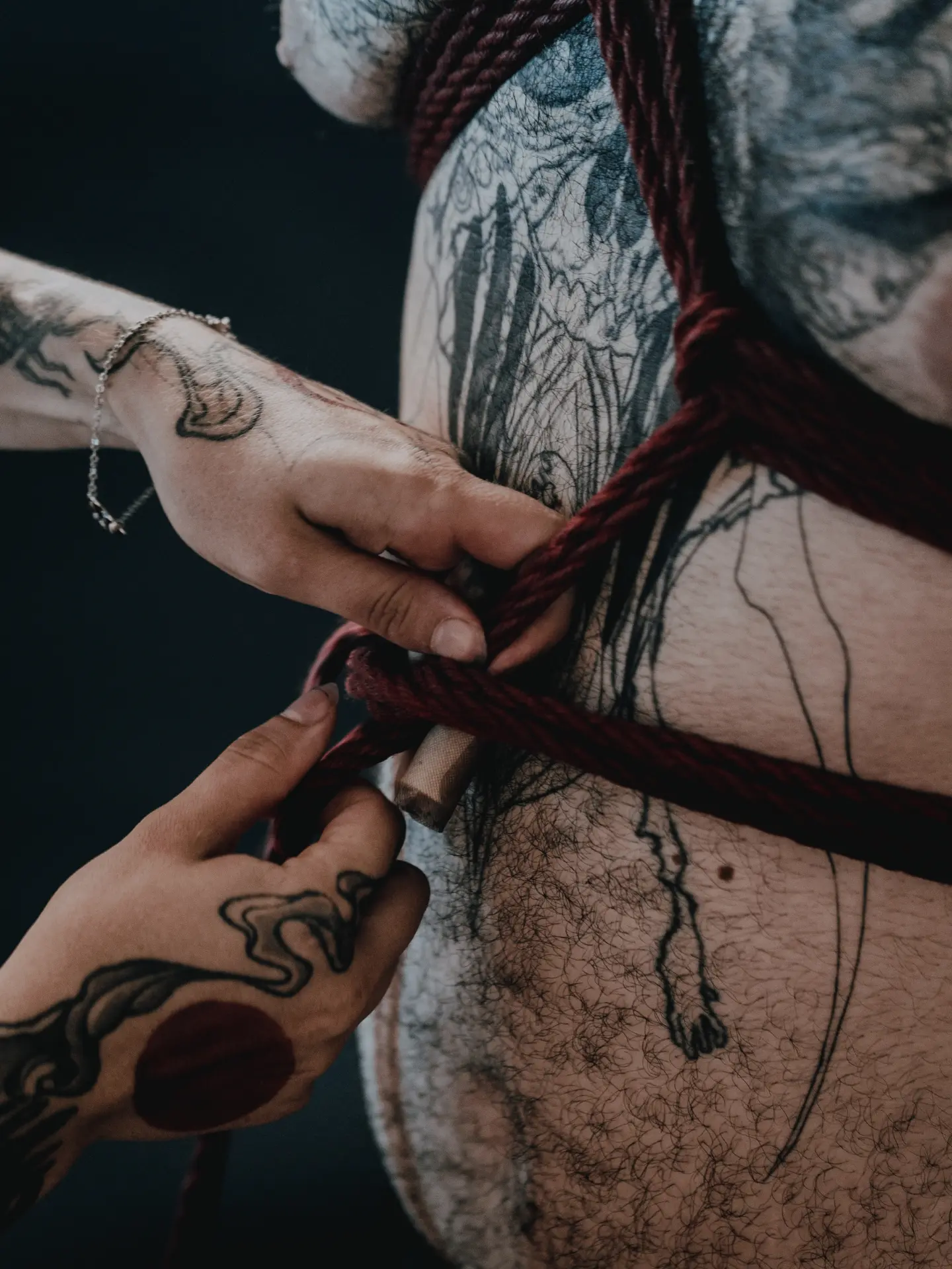Rope and hand American traditional tattoo on the chest by Giovanni Rodriguez, Eastpointe, Michigan