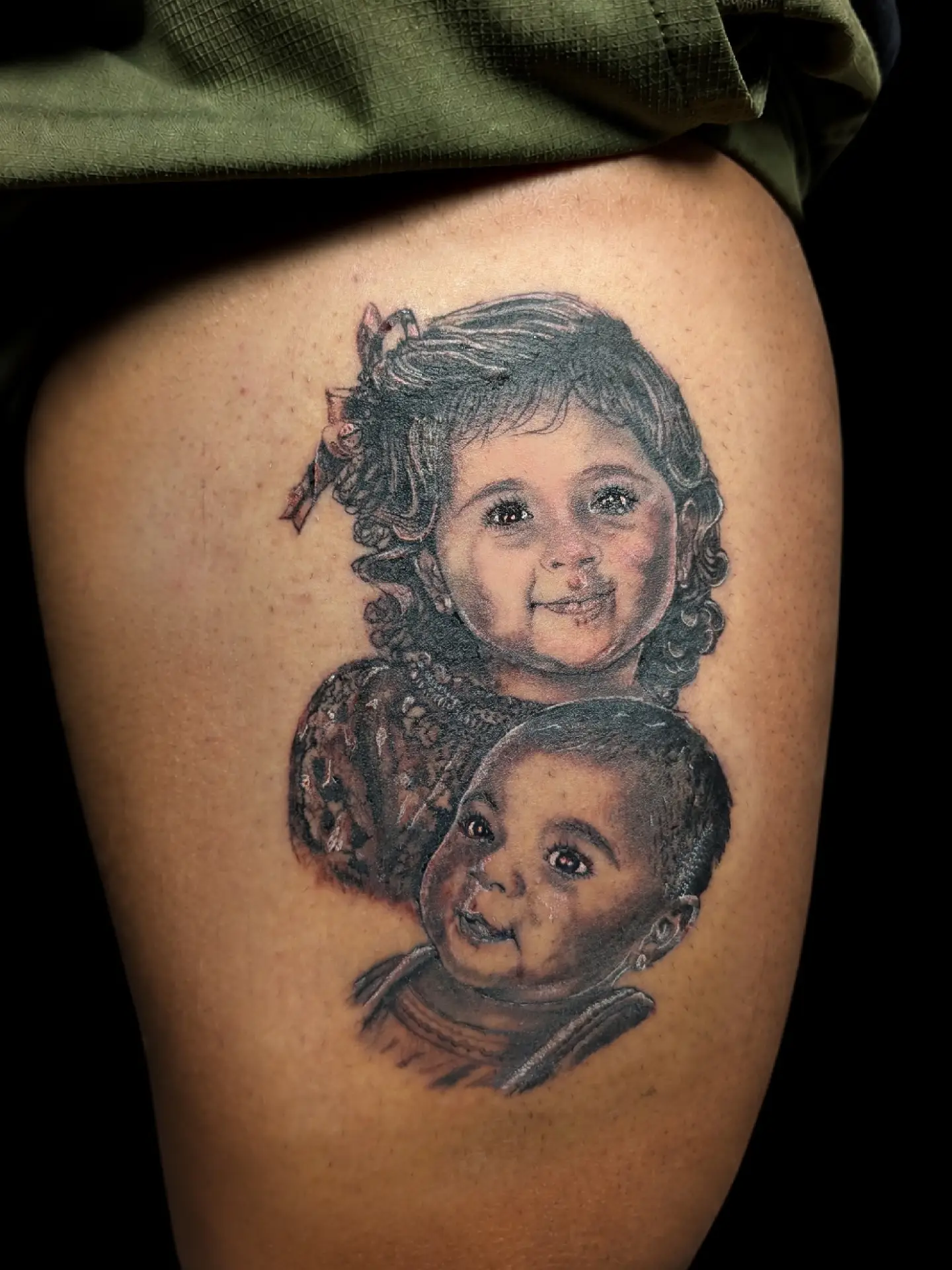 Children realism tattoo on the thigh by Tony