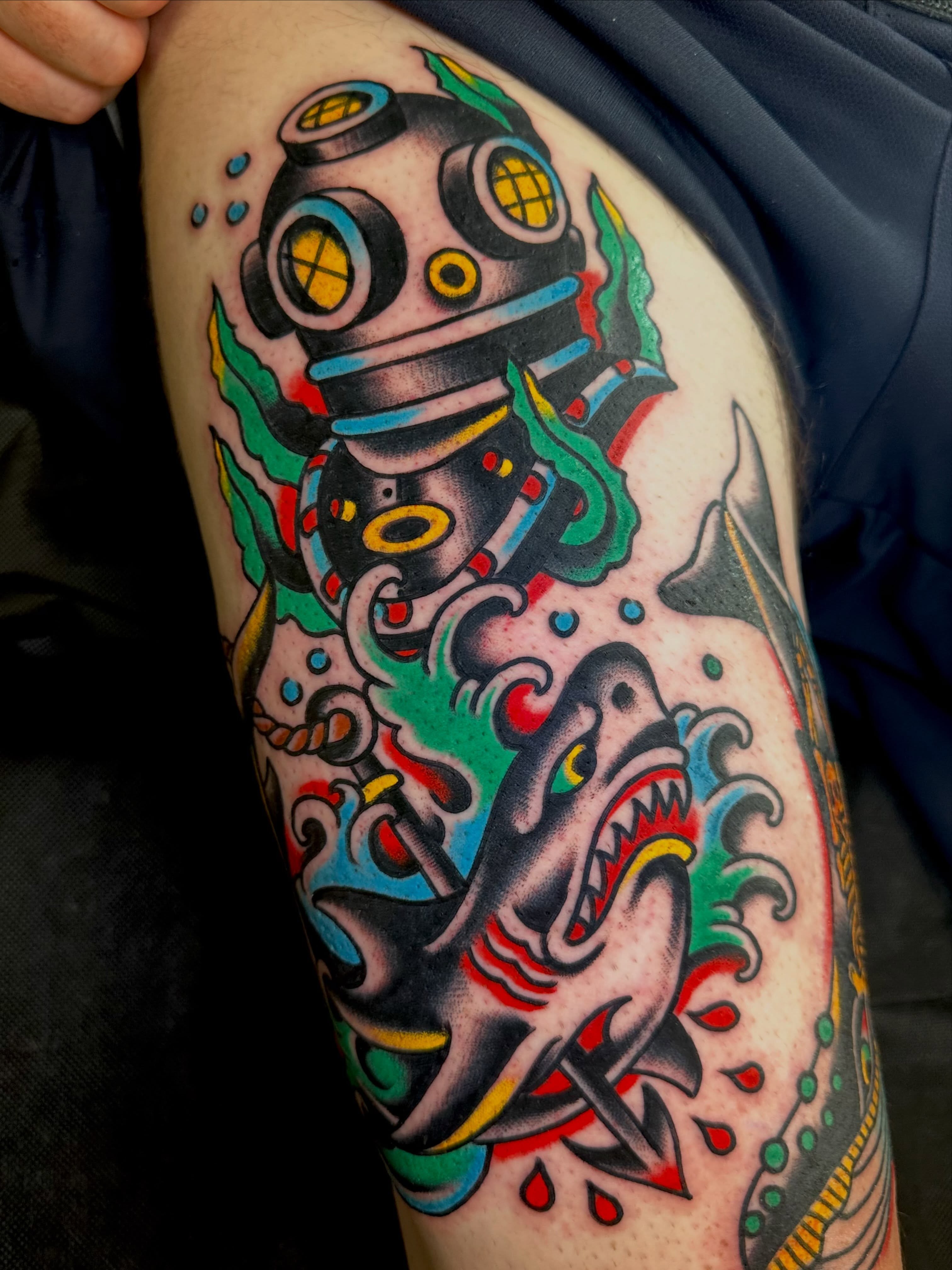 Shark and diving helmet American traditional tattoo on the thigh by Dave G