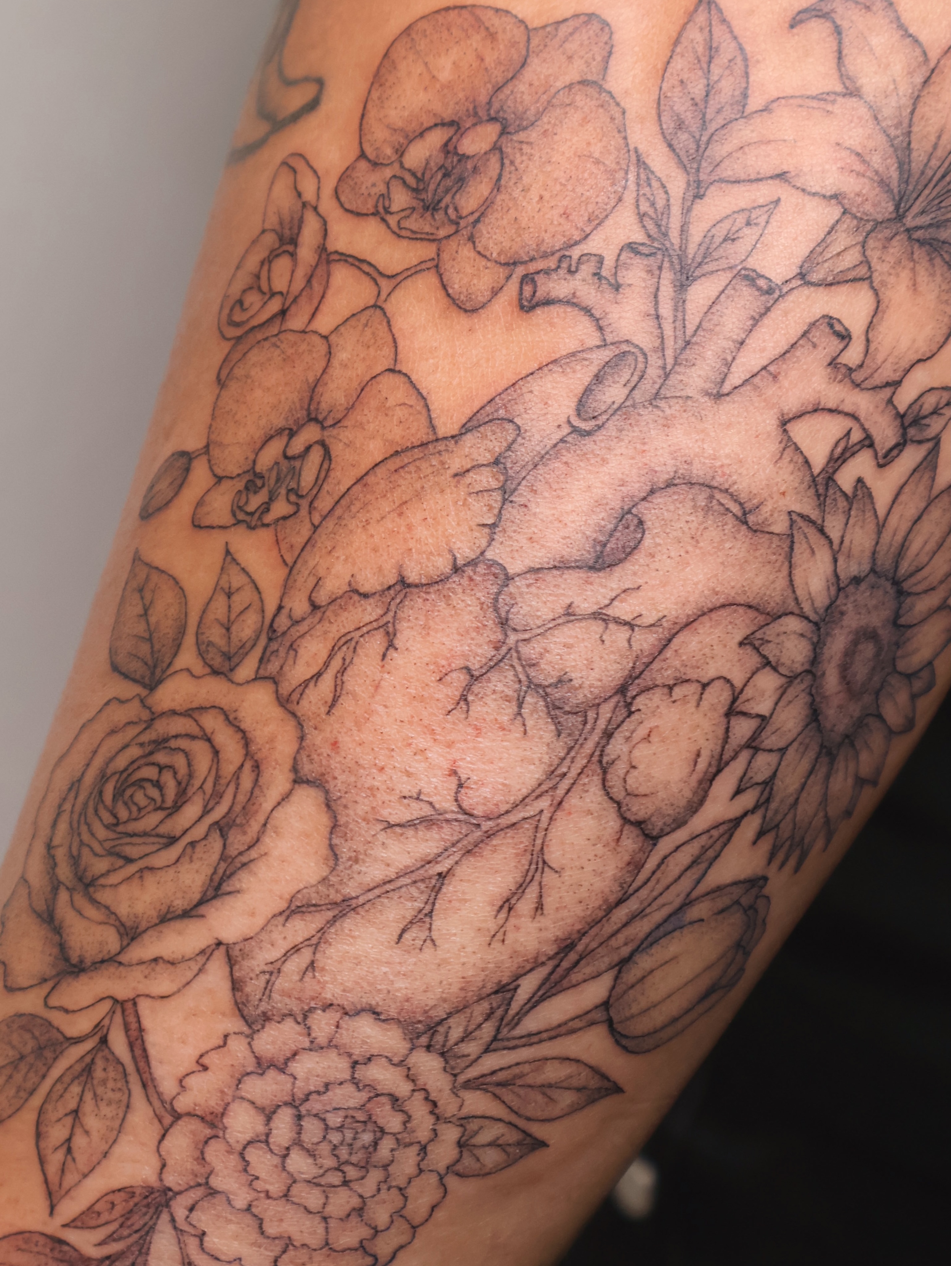 Floral arrangement realism tattoo on the forearm by 𝑭𝒊𝒏𝒆 𝑳𝒊𝒏𝒆 𝑻𝒂𝒕𝒕𝒐𝒐’𝒔