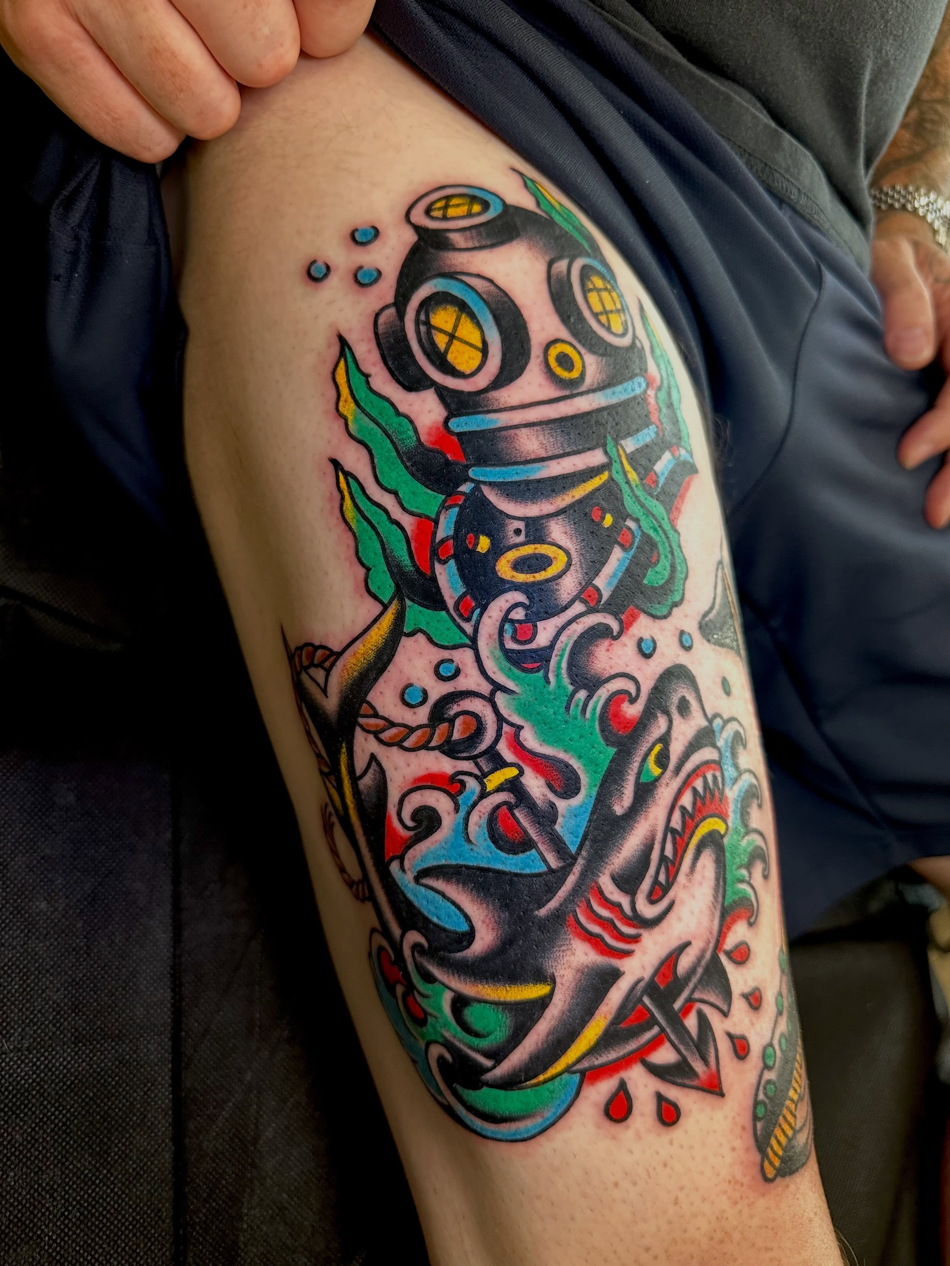 Diver and shark American traditional tattoo on the thigh by Dave G