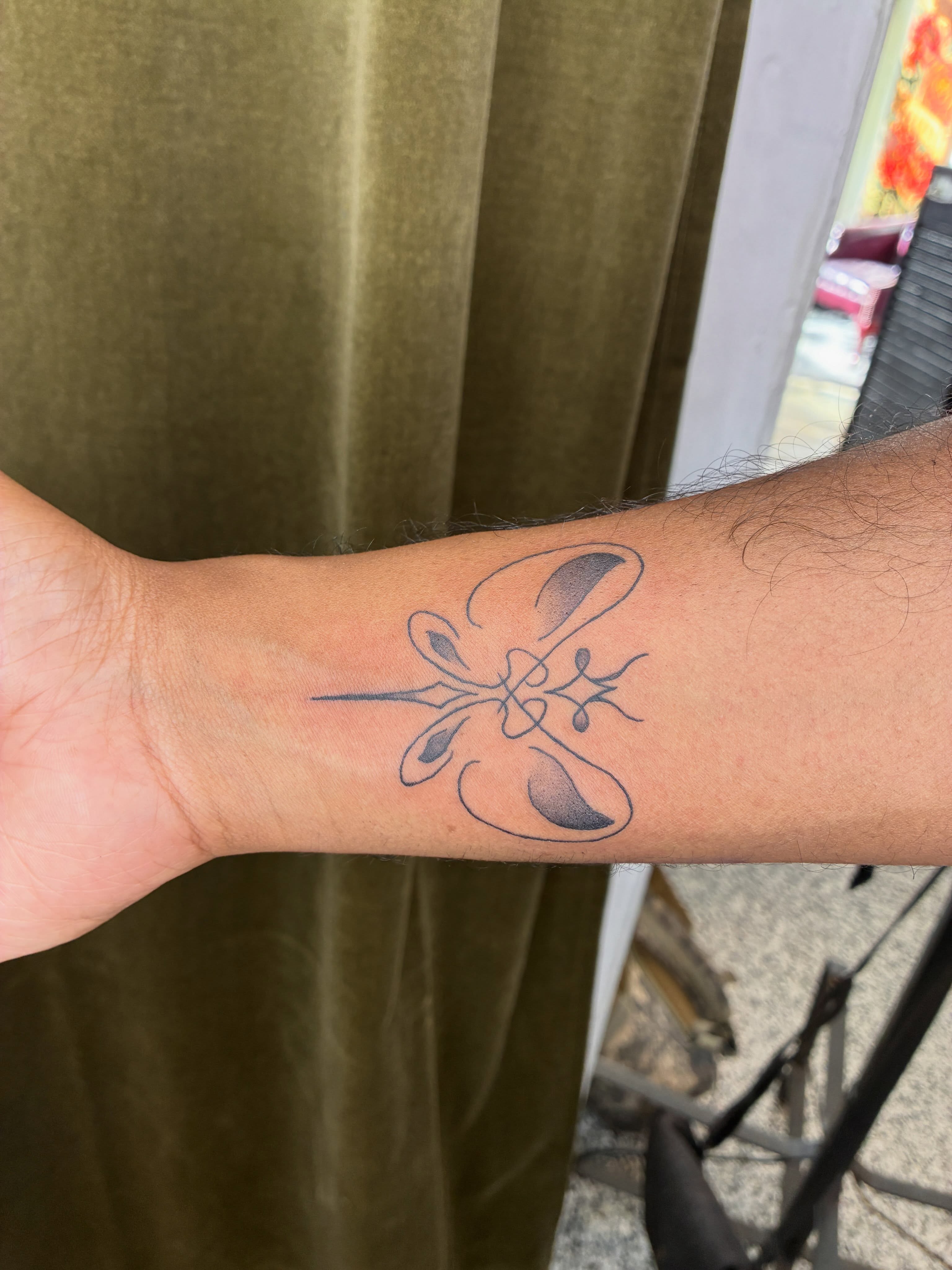 Butterfly geometric tattoo on the forearm by Xin.H
