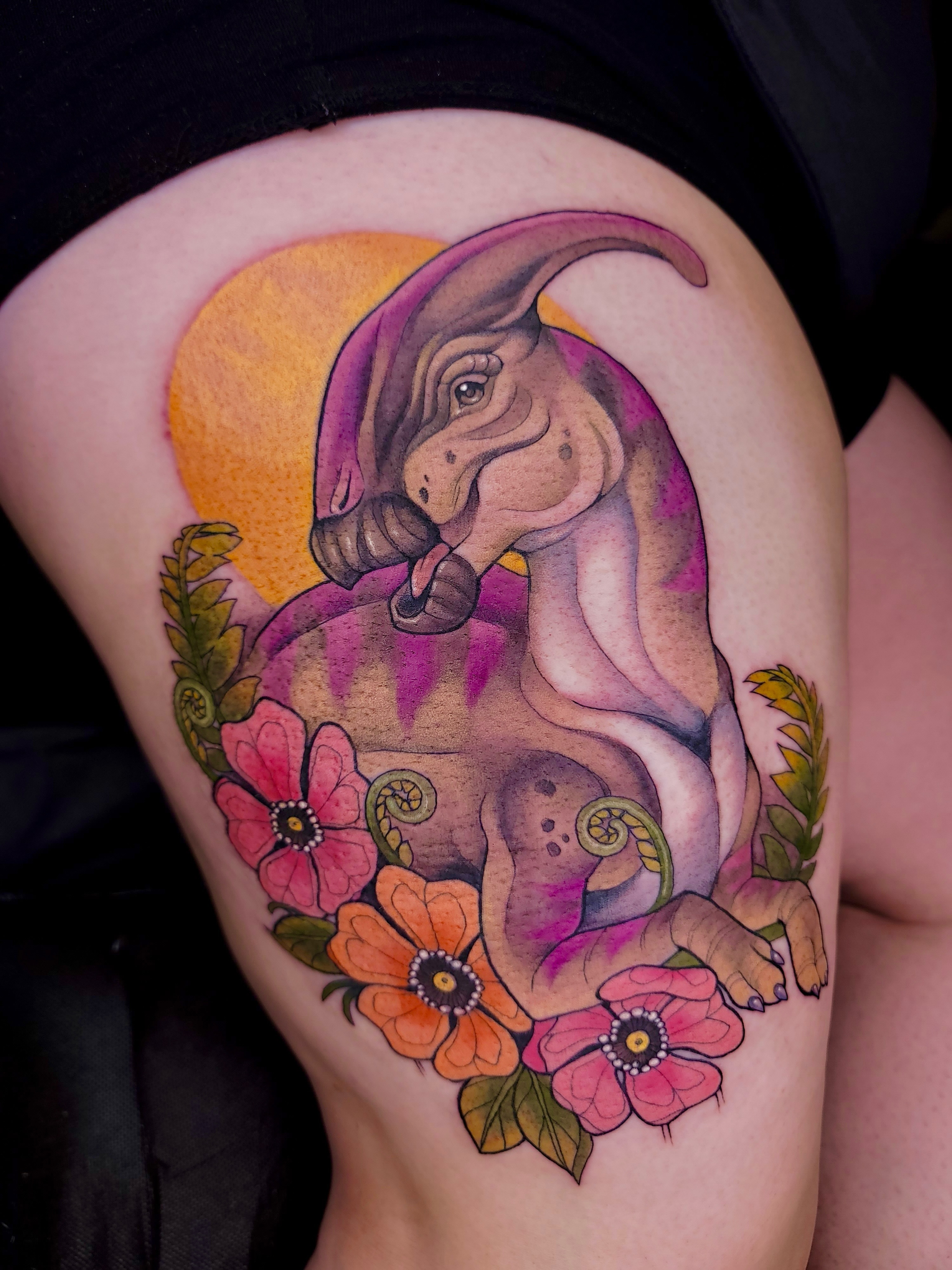 Dinosaur with flowers watercolor tattoo on the thigh by πΌπππΎππΌ π
πΌππππ
