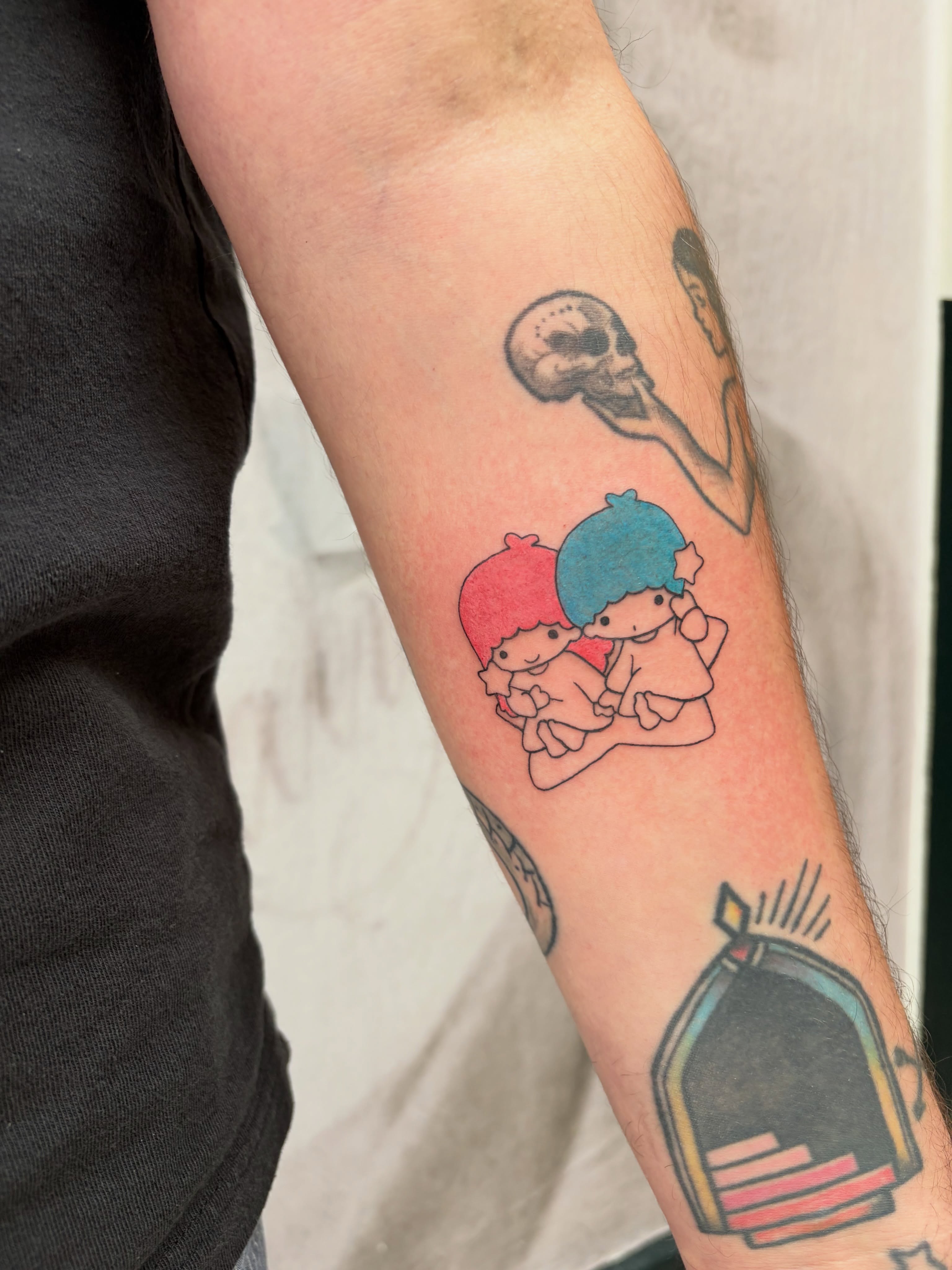 Anime characters anime tattoo on the forearm by Kyra Monterrosa
