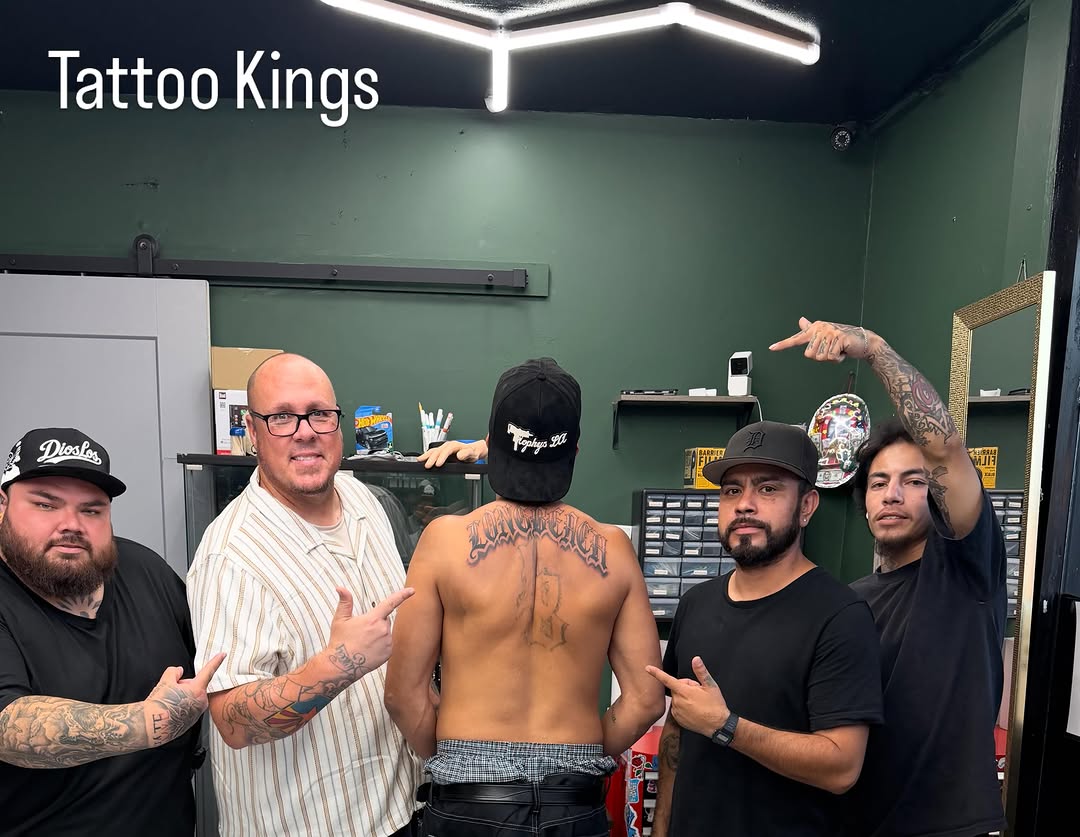 Back script lettering script tattoo on the back by Shadows Tattoos
