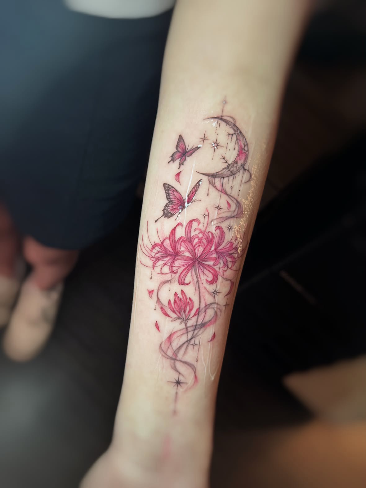Flowers and butterflies watercolor tattoo on the forearm by 墨匠紋身|新店店, New Taipei City
