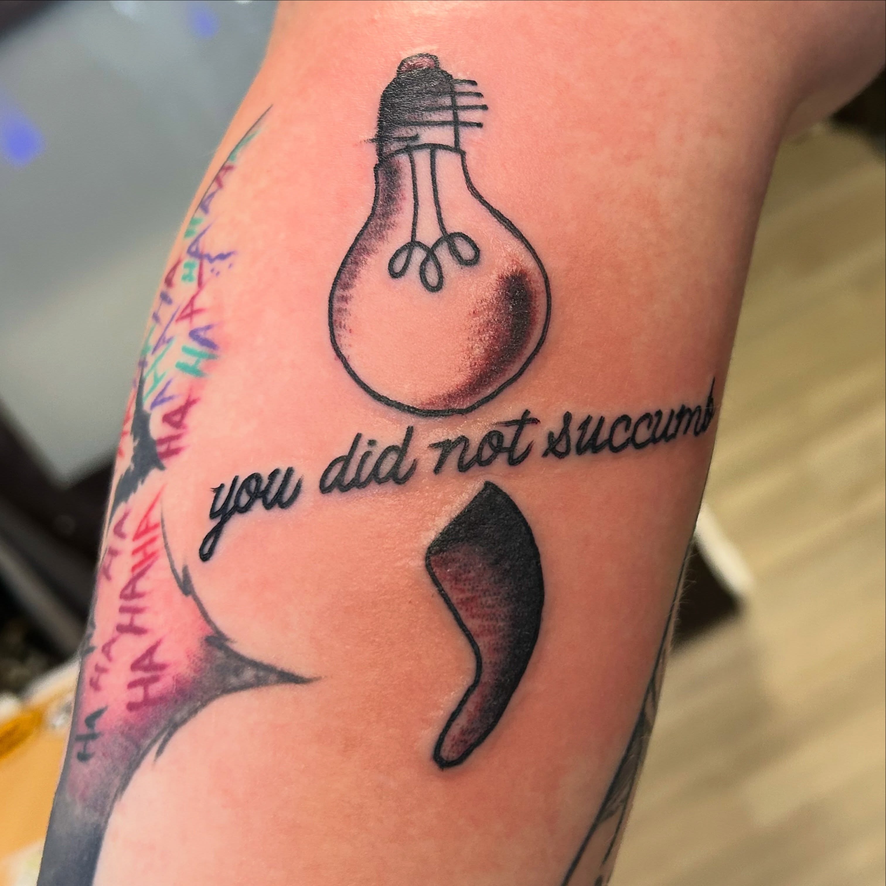 Light bulb black and grey tattoo on the forearm by Erik Sacony