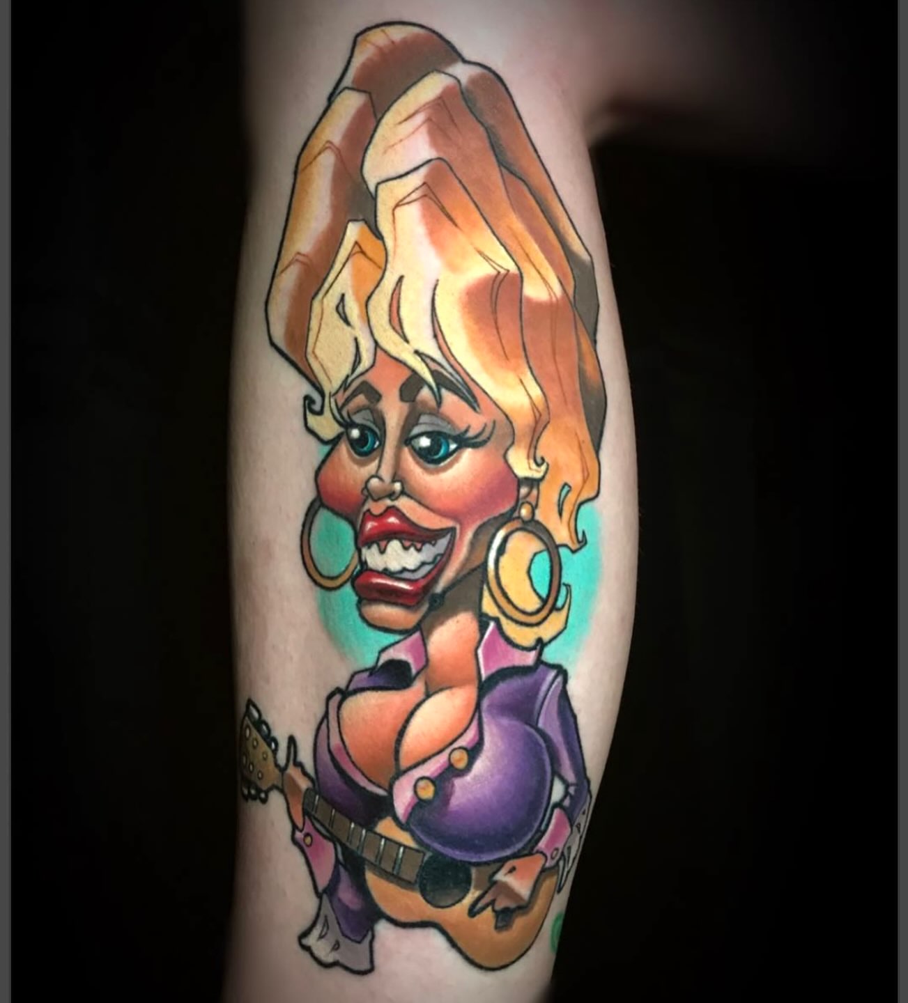 Dolly Parton caricature American traditional tattoo on the forearm by Joshua L Wilson, Dayton, Ohio