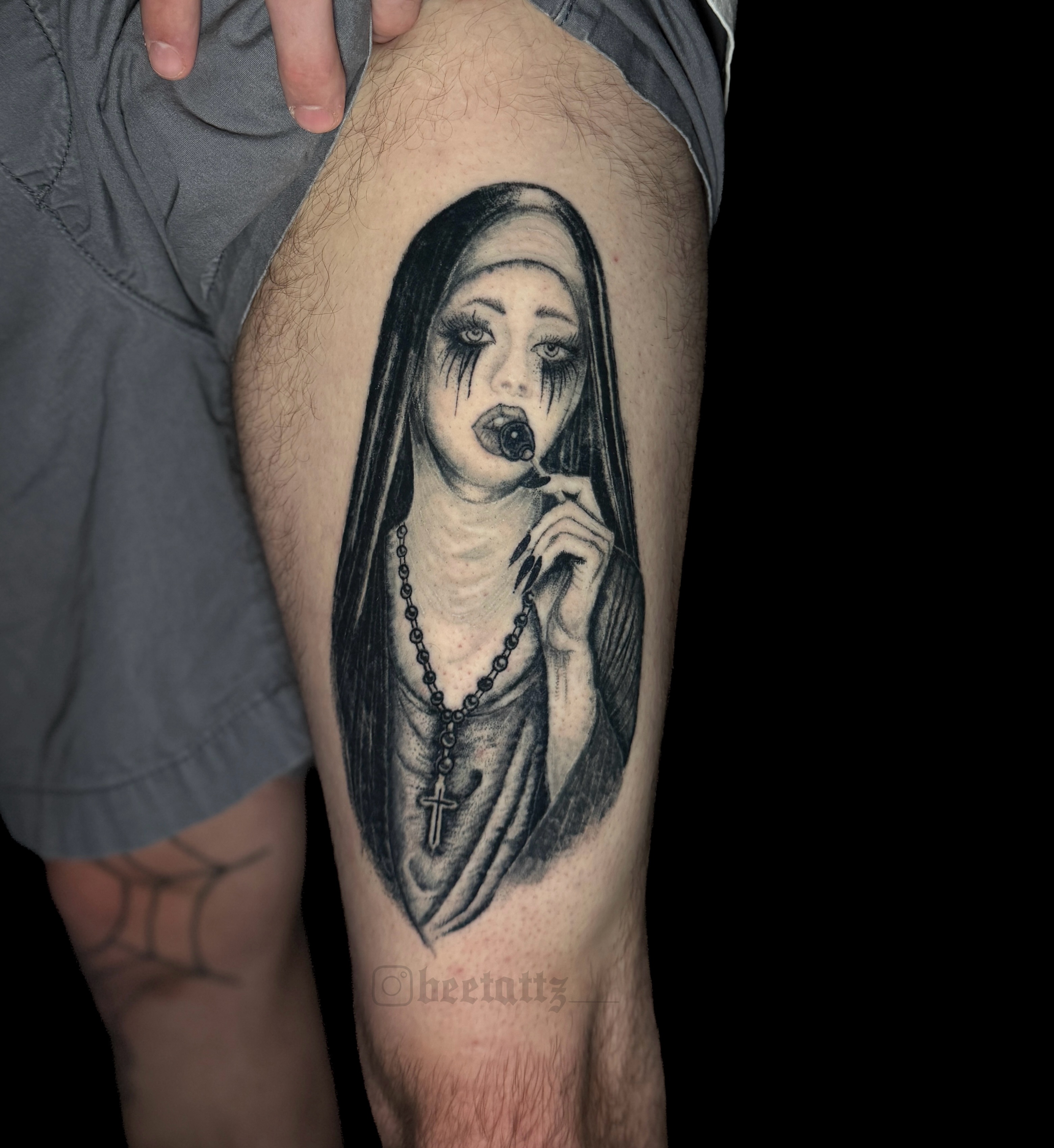 Nun with rosary realism tattoo on the thigh by Brinkley McGill