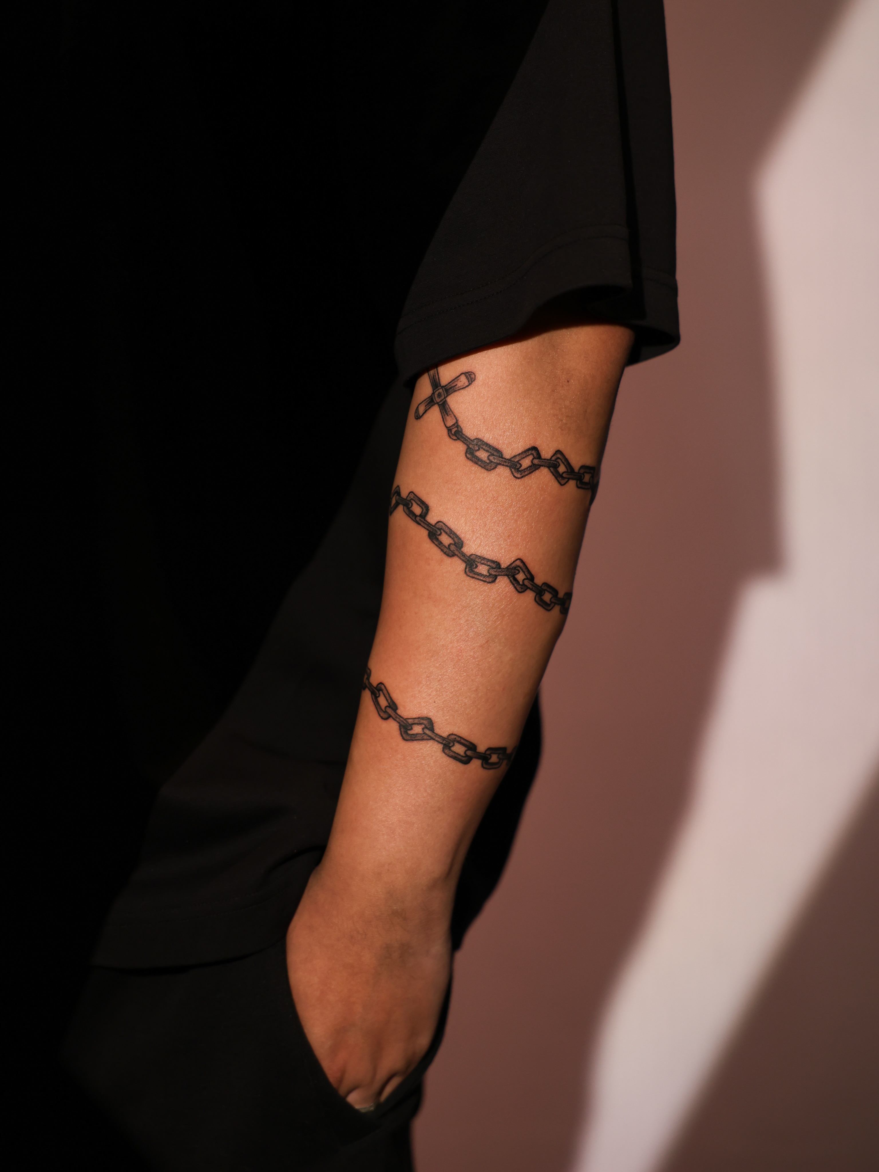 Chains black and grey tattoo on the forearm by Josh Brownell
