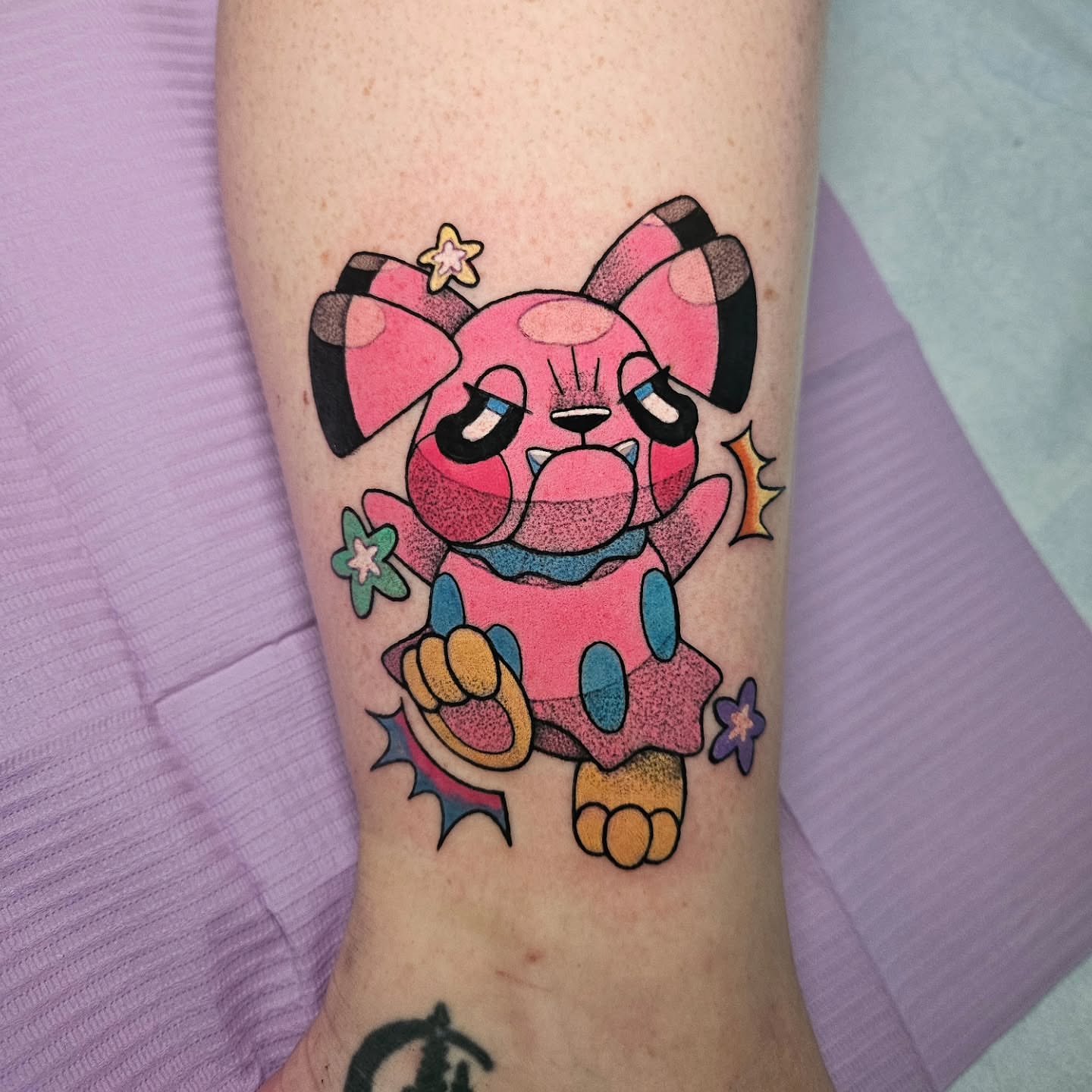 Anime dog dotwork tattoo on the forearm by Gray