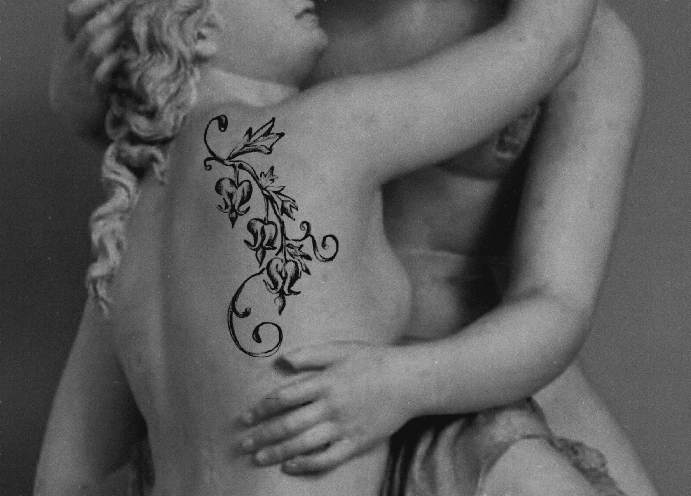Floral vine black and grey tattoo on the back by °₊⊹ delia ✩ jane ೃ࿔*