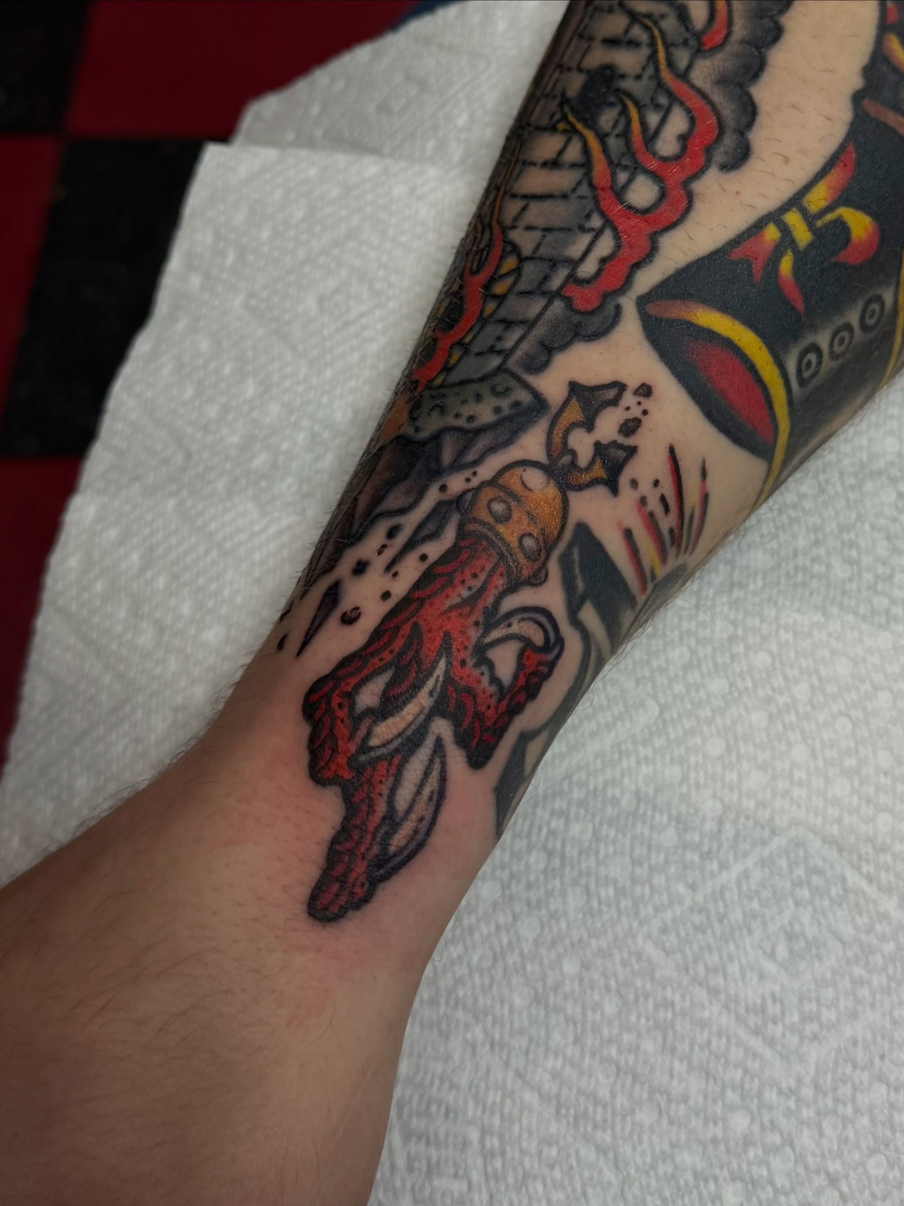 Flame and skull American traditional tattoo on the forearm by Patrick Miller, Huber Heights, Ohio