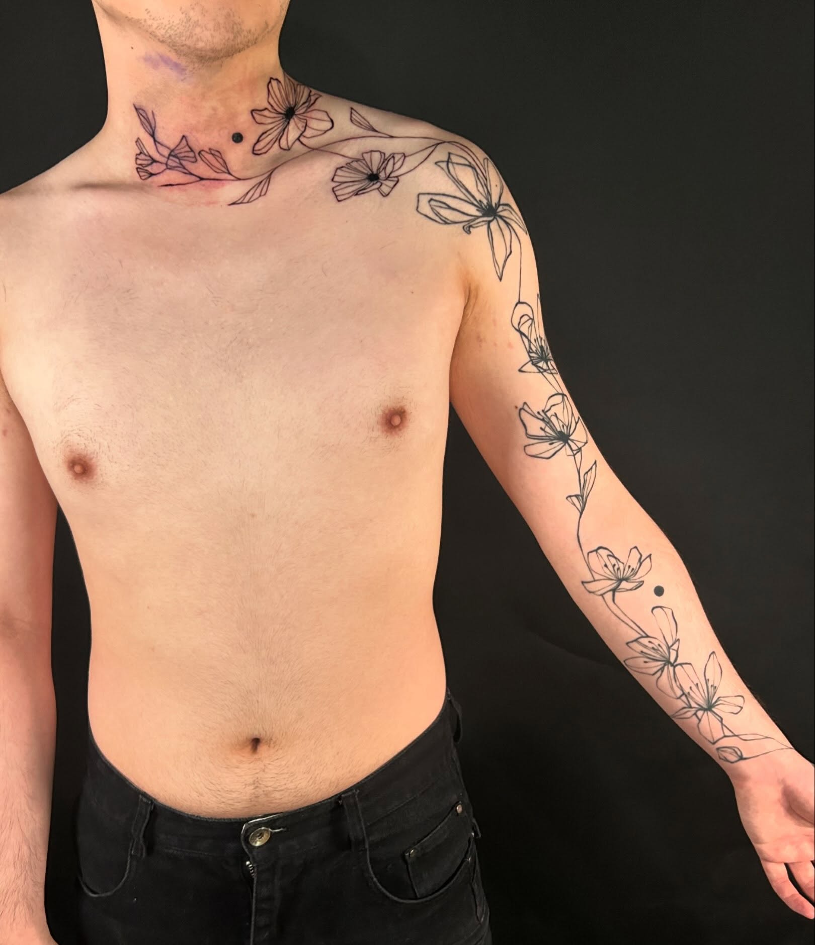 Floral design black and grey tattoo on the upper arm by @laurabochet_tattoo, Beacon, NY