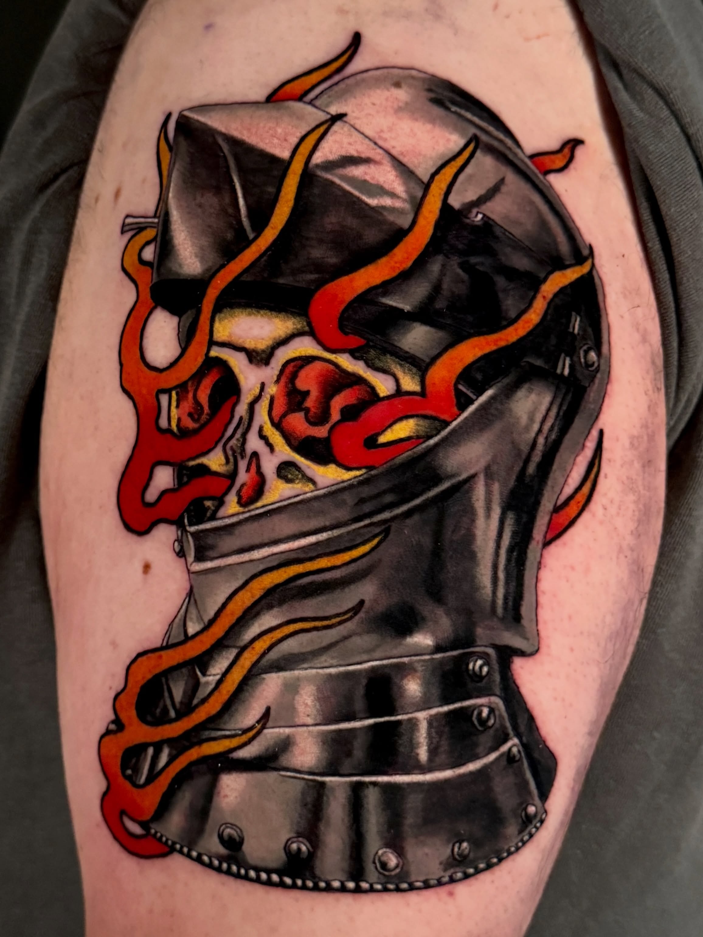 Flaming helmet realism tattoo on the forearm by Dallas Tattoo Artist