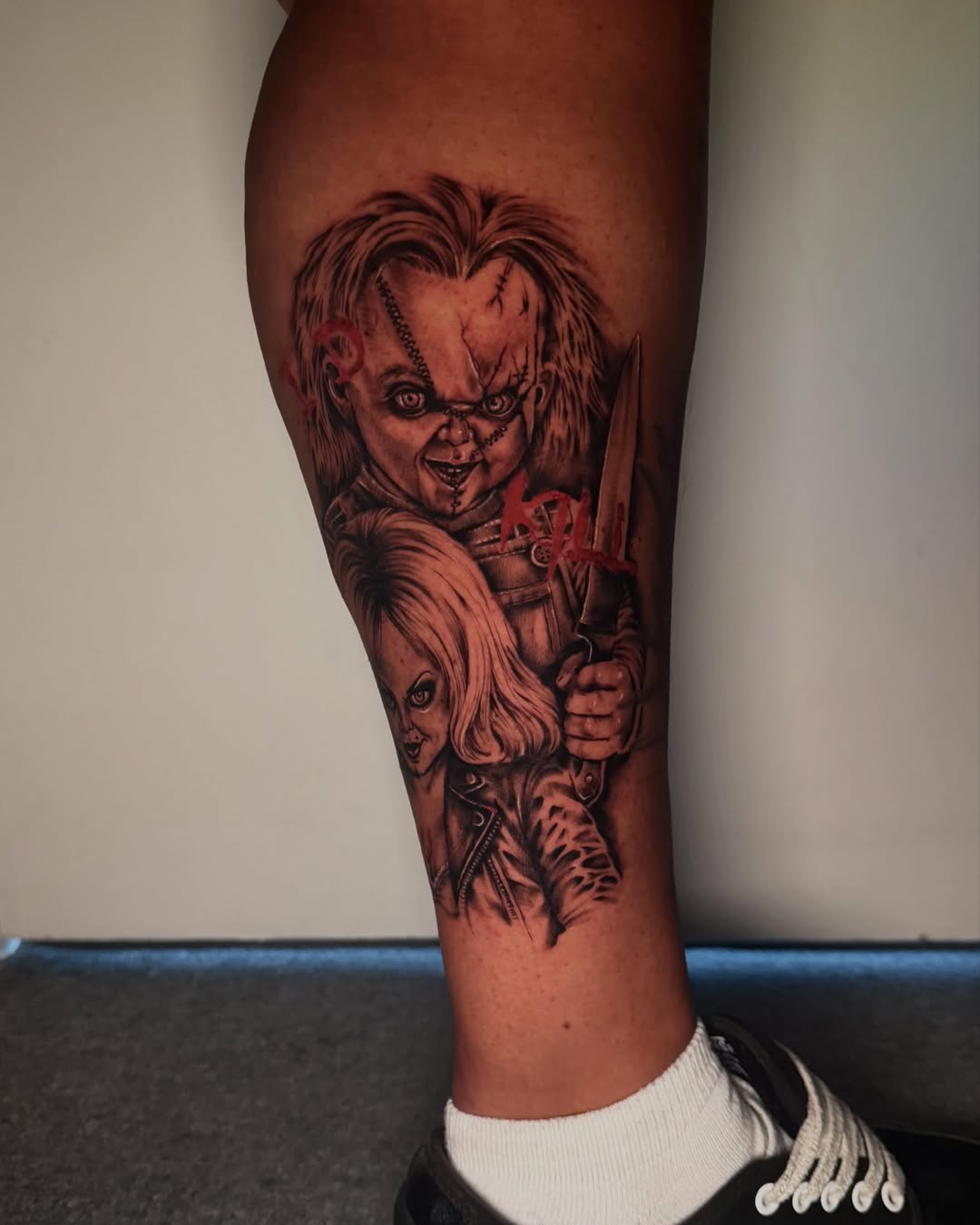 Chucky and Tiffany realism tattoo on the calf by Emma Mathis, Springfield, Oregon