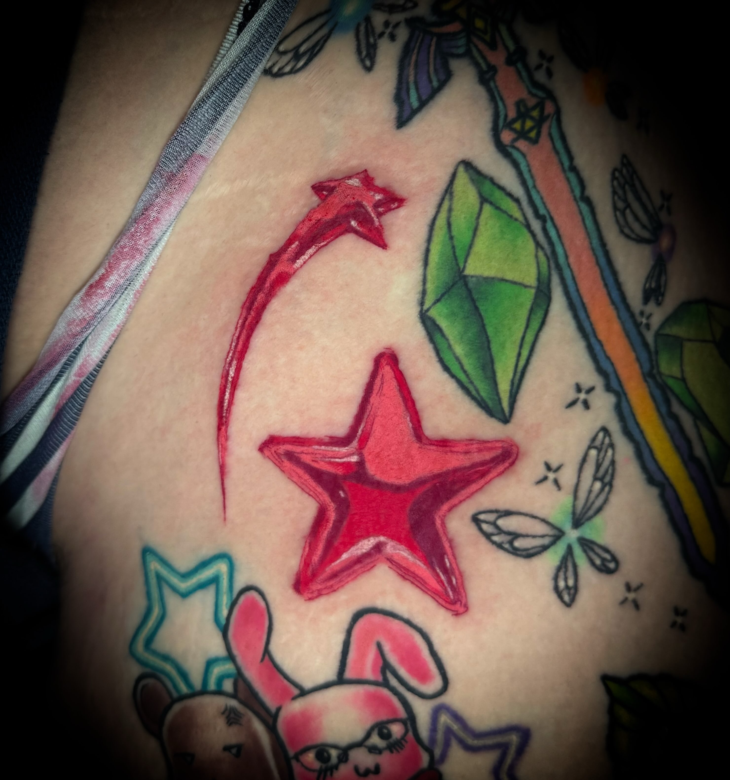 Star and gem American traditional tattoo on the shoulder by Savannah Duff
