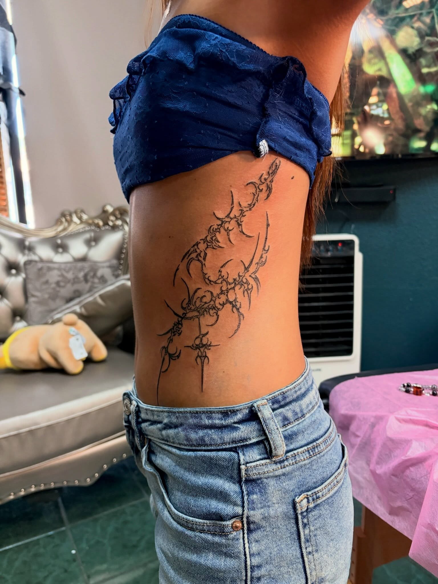 Floral design black and grey tattoo on the ribs by tati 🇬🇺🇵🇭