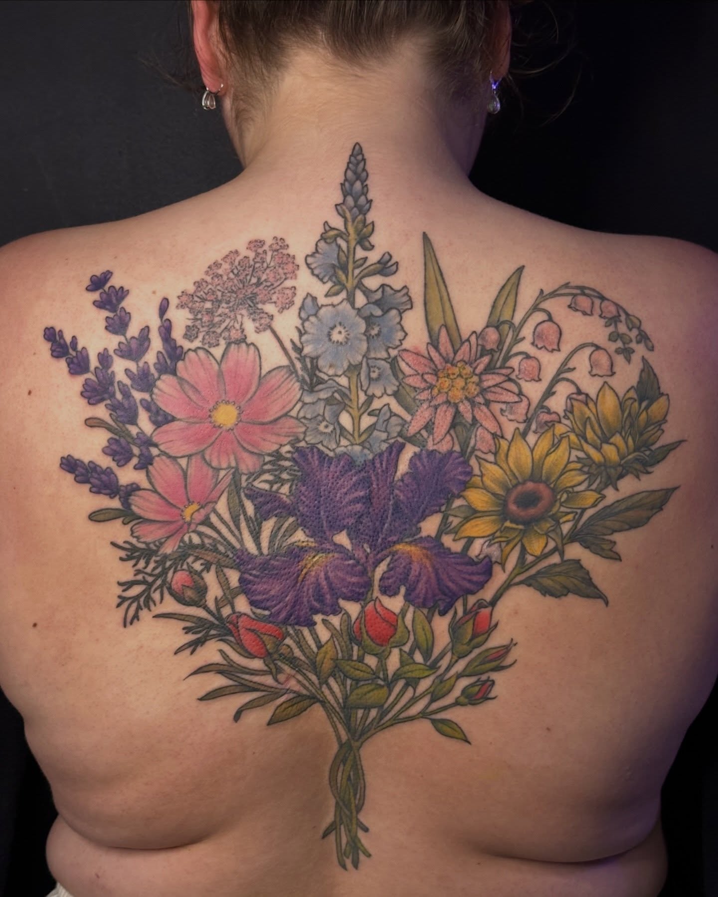 Flower bouquet realism tattoo on the back by Classy Fucking Lady Tattooer