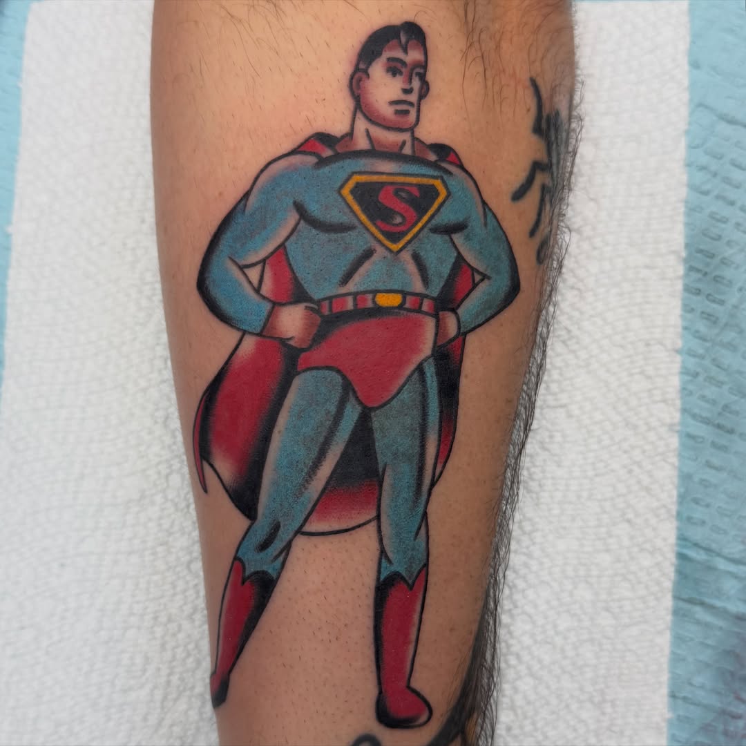 Superman American traditional tattoo on the forearm by Carl Testi