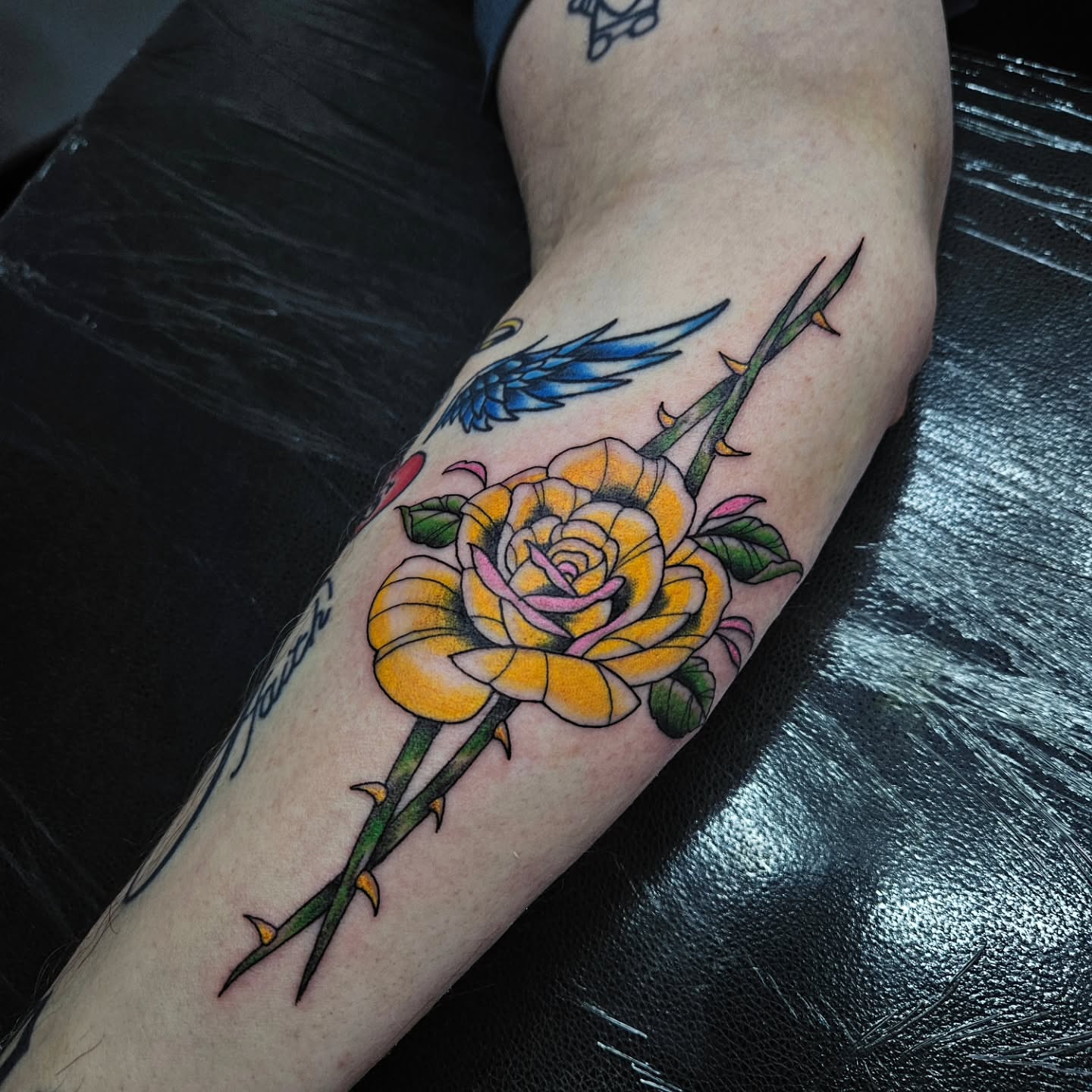 Yellow rose with thorns American traditional tattoo on the forearm by Danny