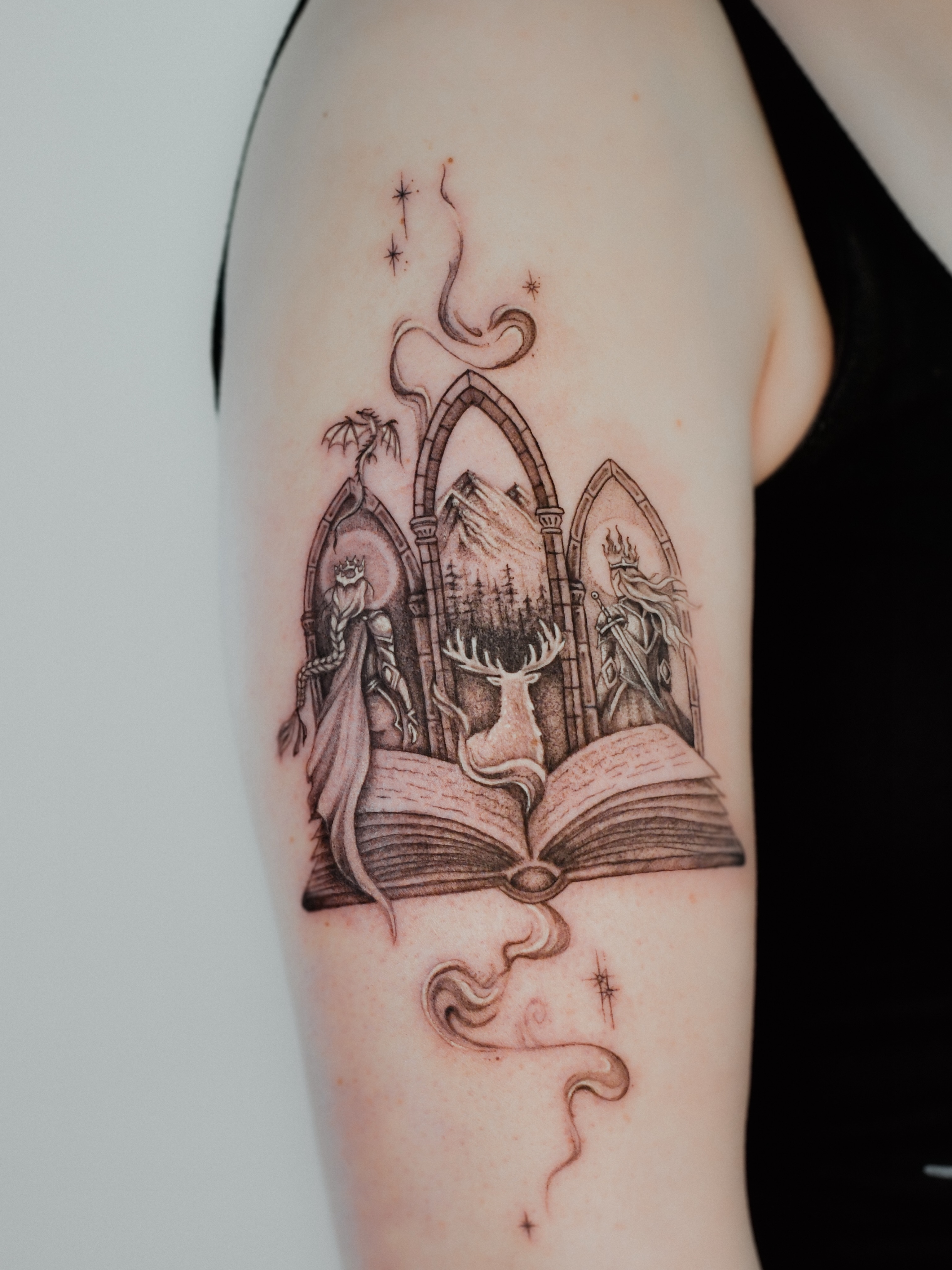 Open book with arches and figures realism tattoo on the forearm by 𝐇𝐚𝐫𝐩𝐞𝐫