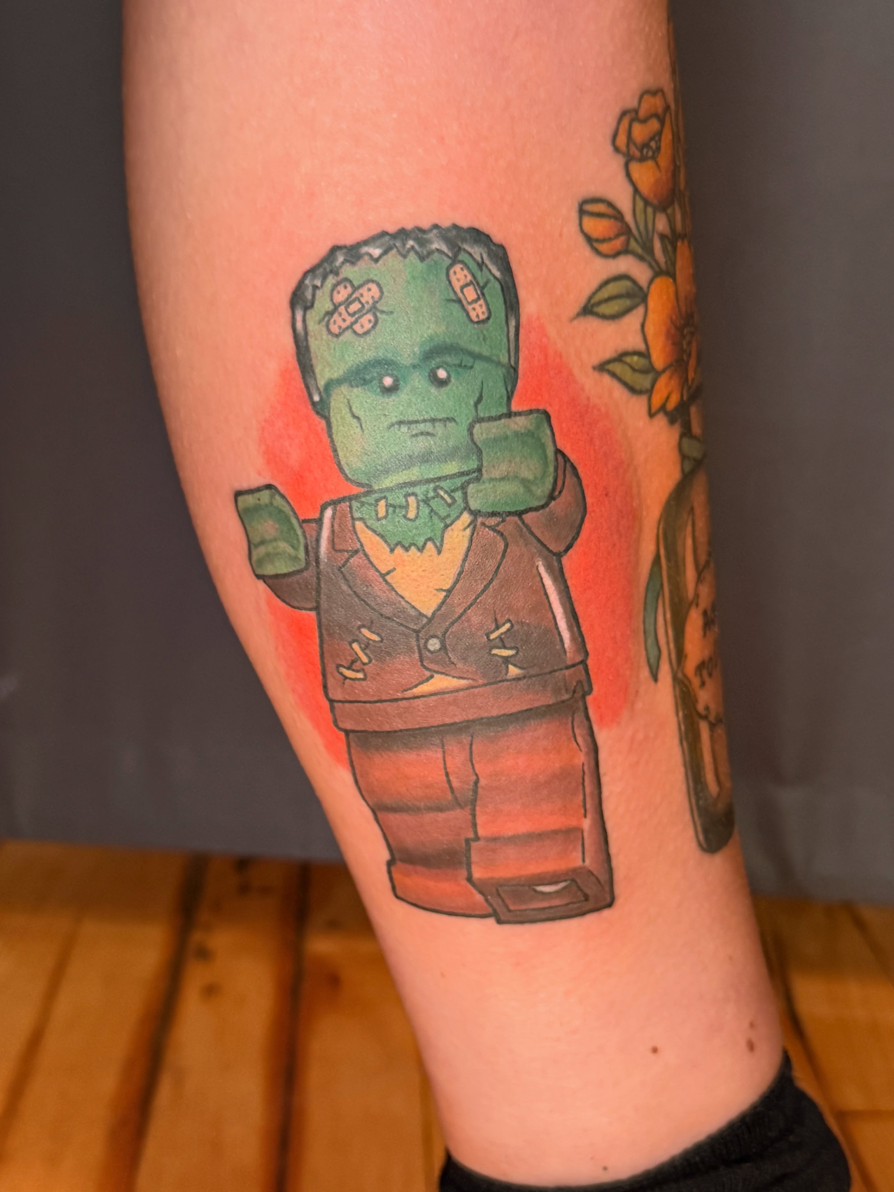 Frankenstein LEGO minifigure new school tattoo on the forearm by Ty Hamilton