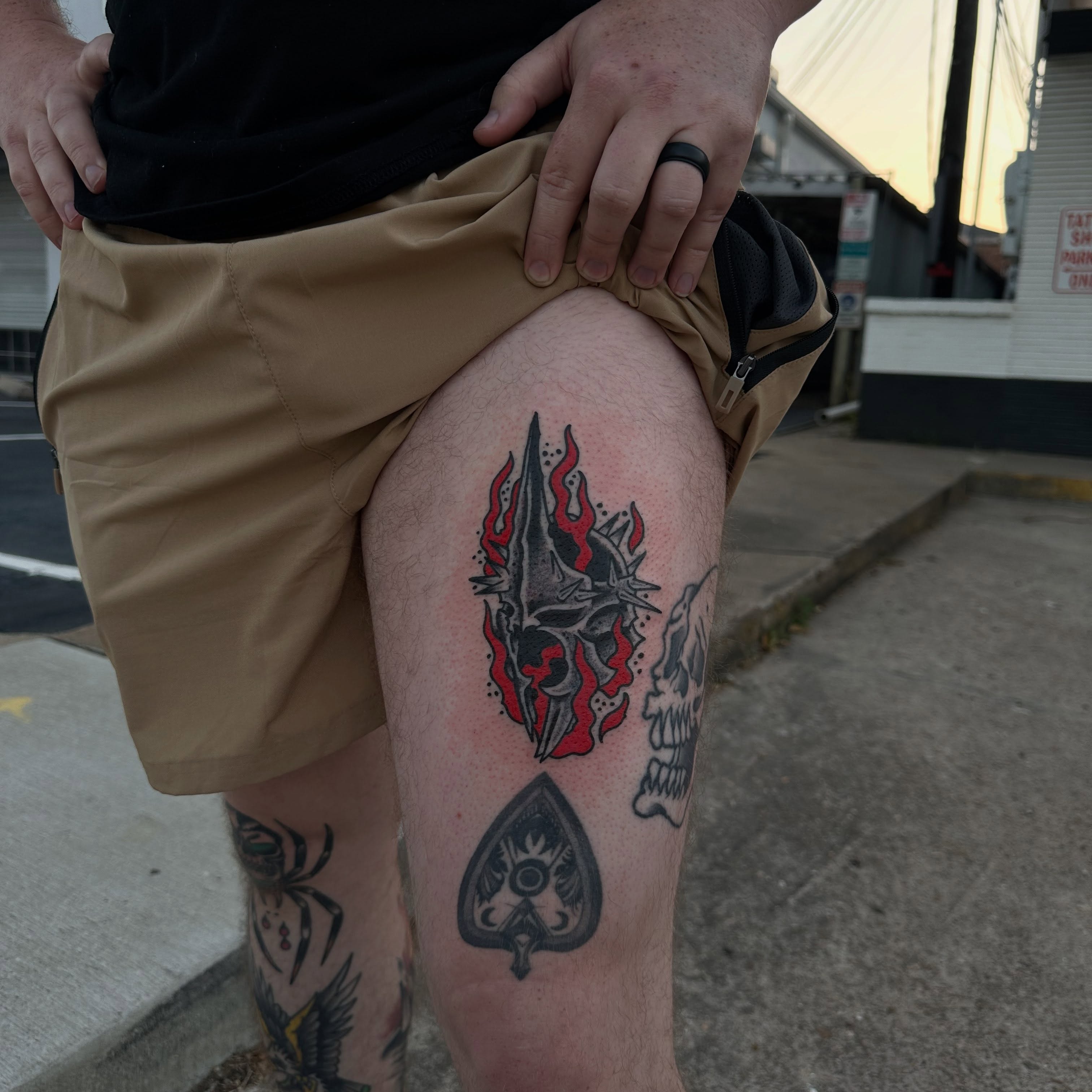 Flaming skull neo-traditional tattoo on the thigh by Logan Perry