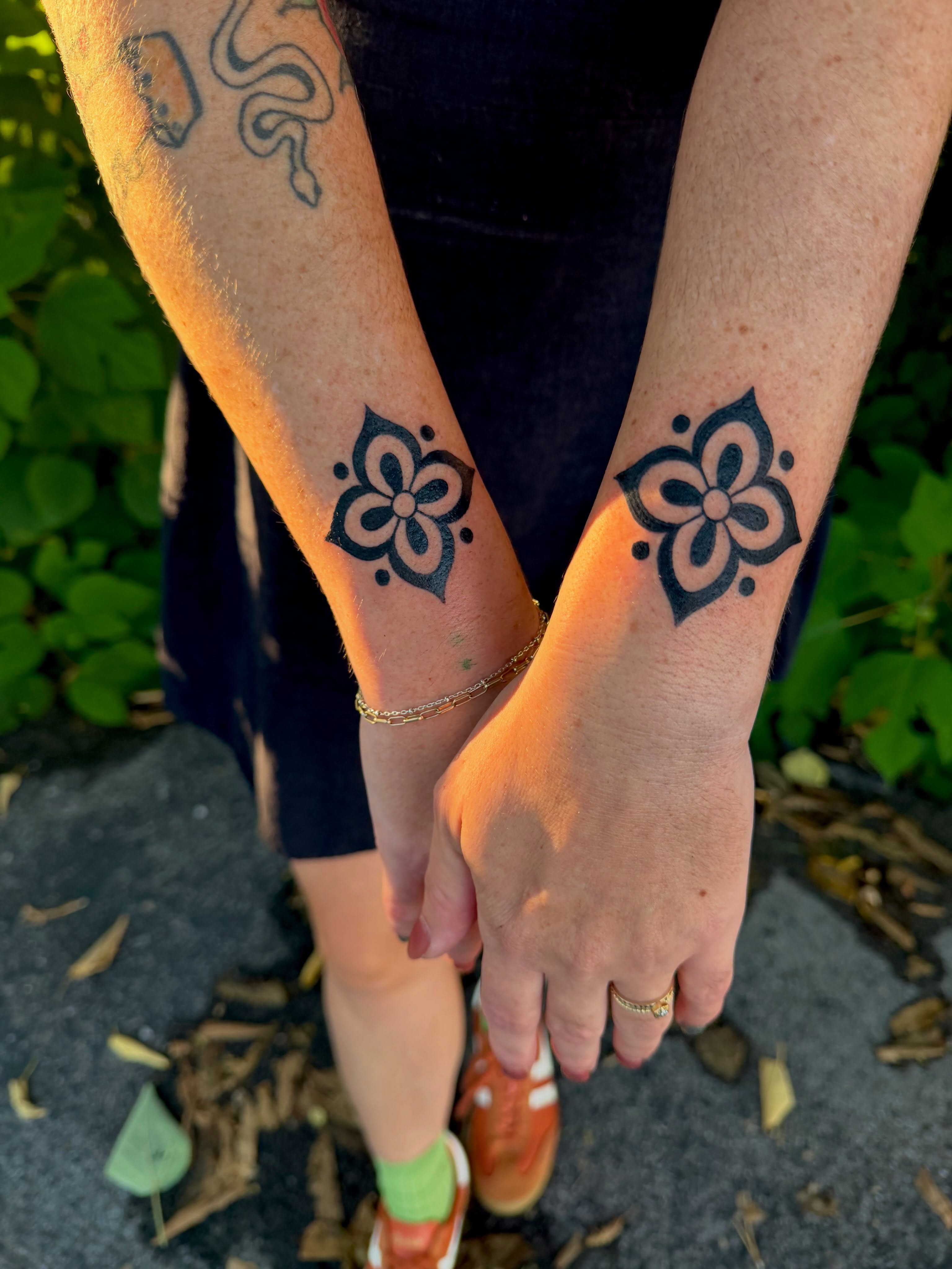 Flower dotwork tattoo on the forearm by Nova Vaughn