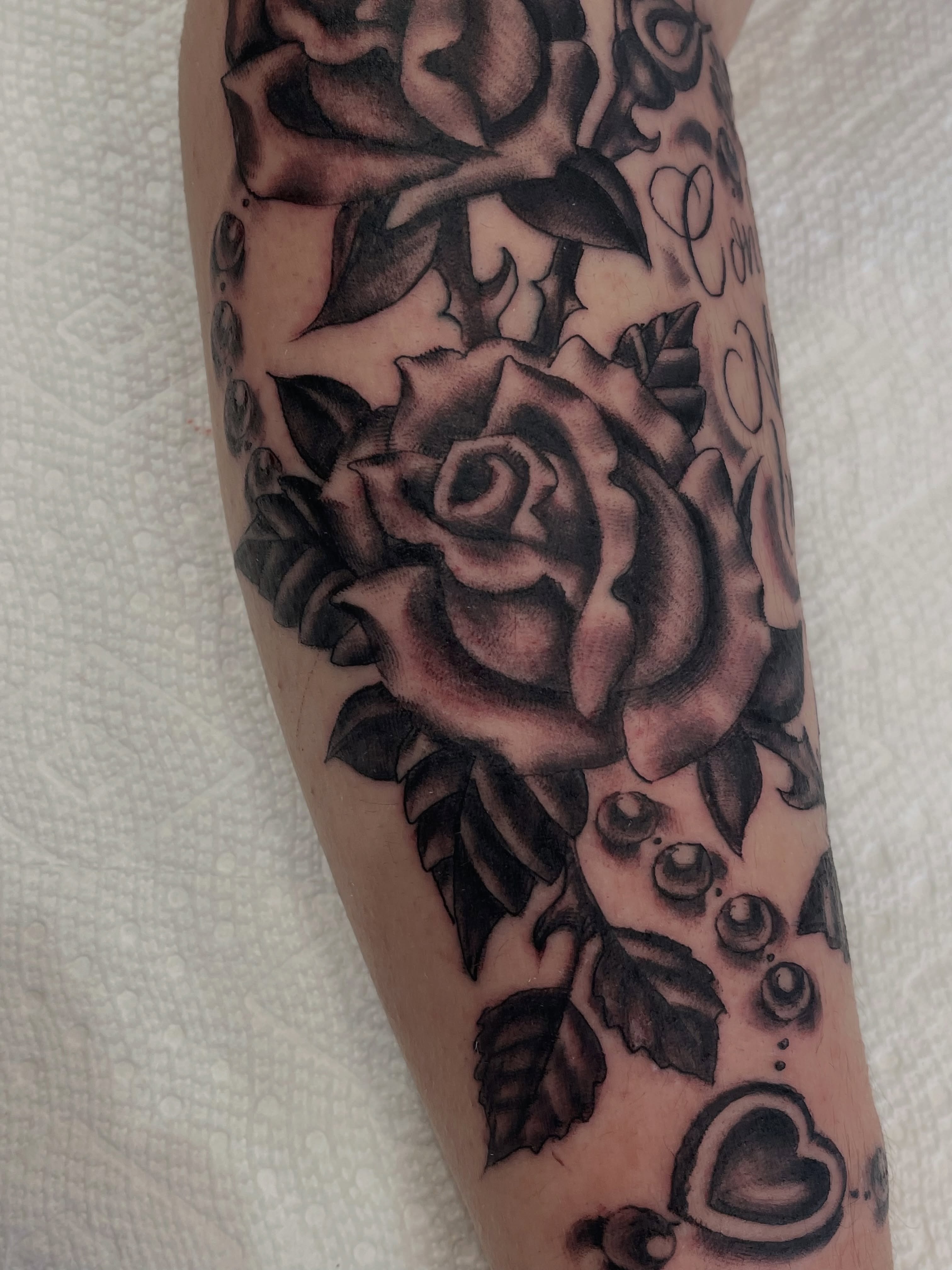 Rose black and grey tattoo on the forearm by Alex Garcia - Sac City Tattoo