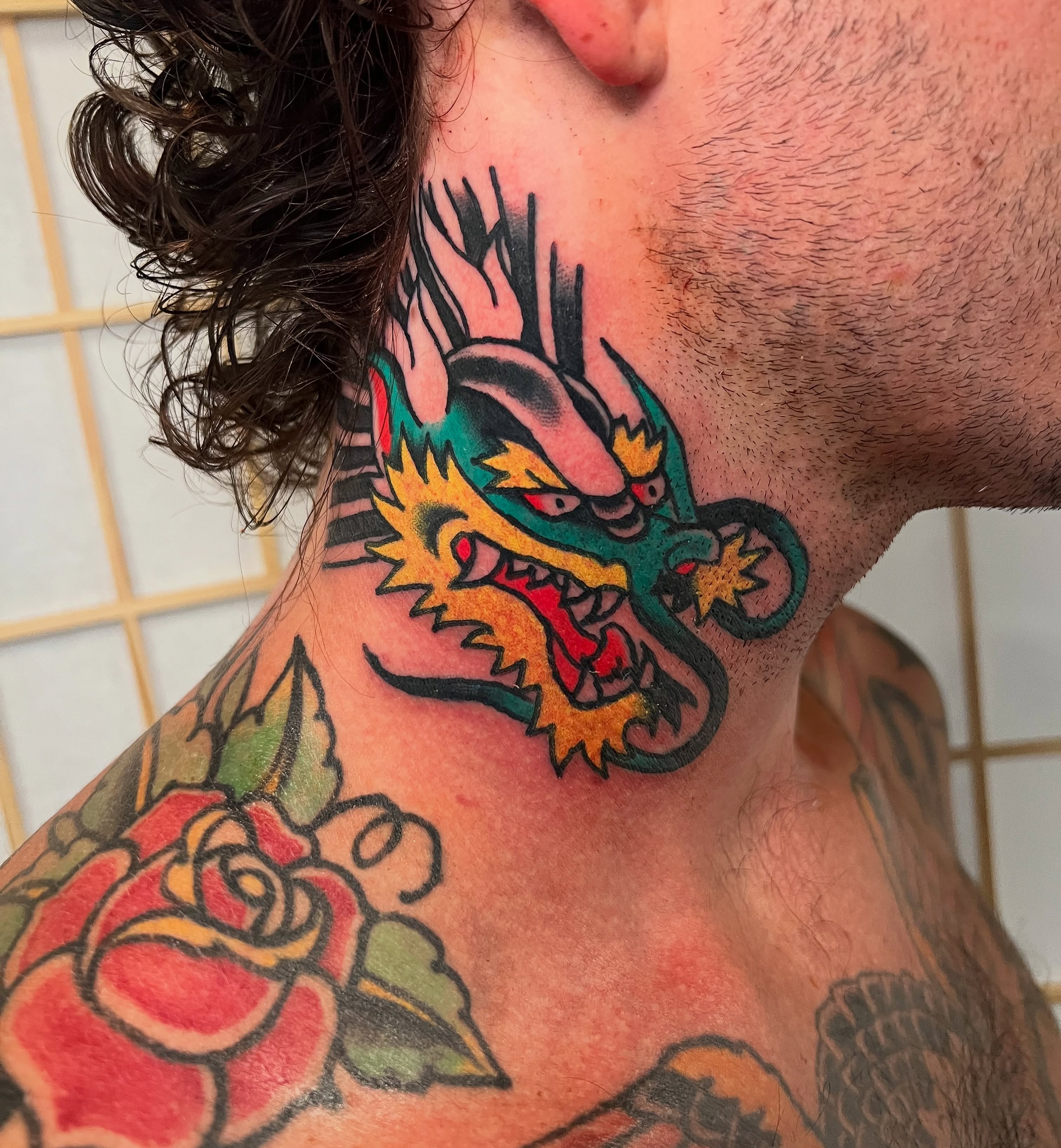 Dragon American traditional tattoo on the neck by Nestor Zelaya