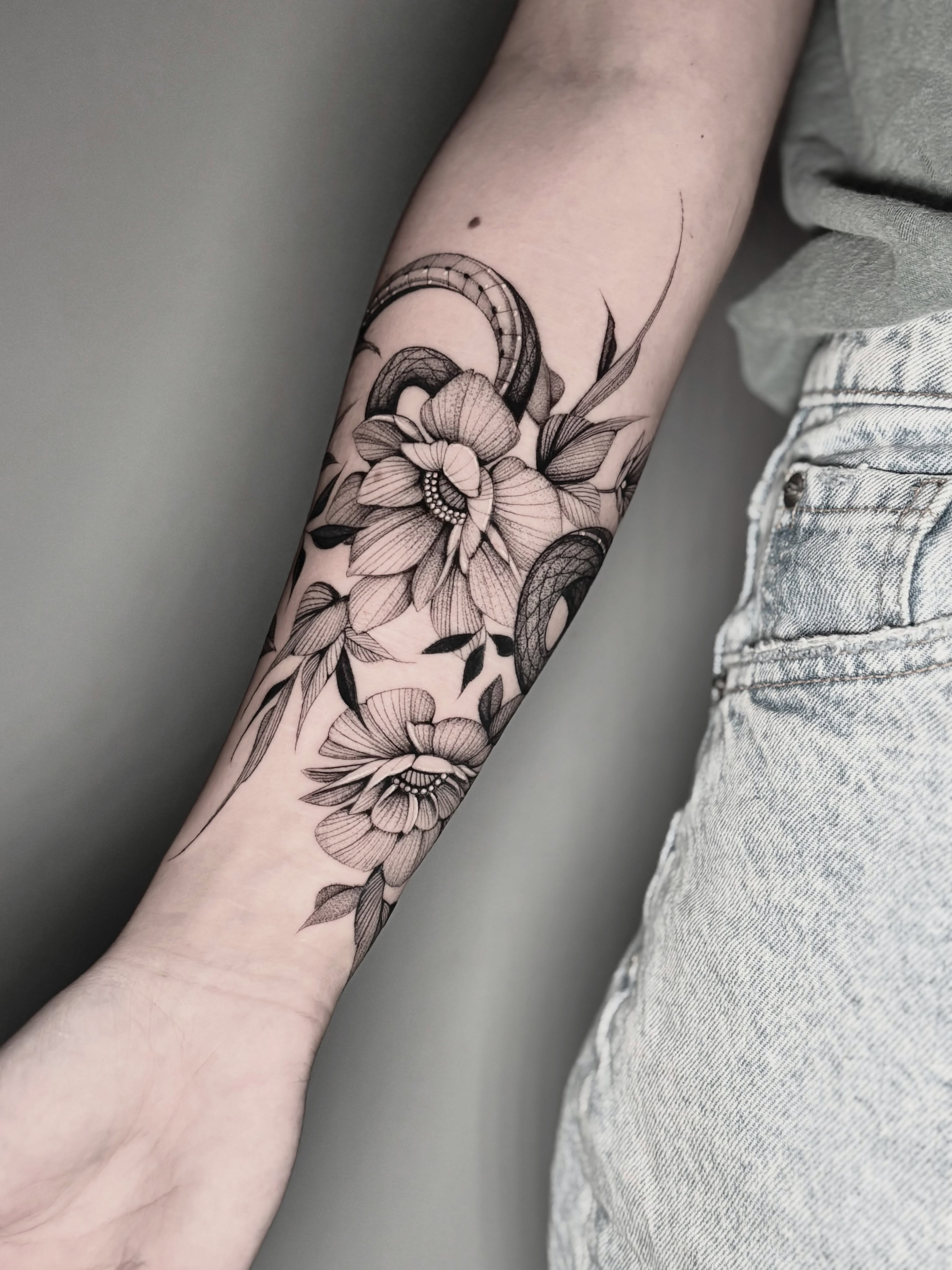 Floral bouquet realism tattoo on the forearm by Brittney Naami, San Francisco, California