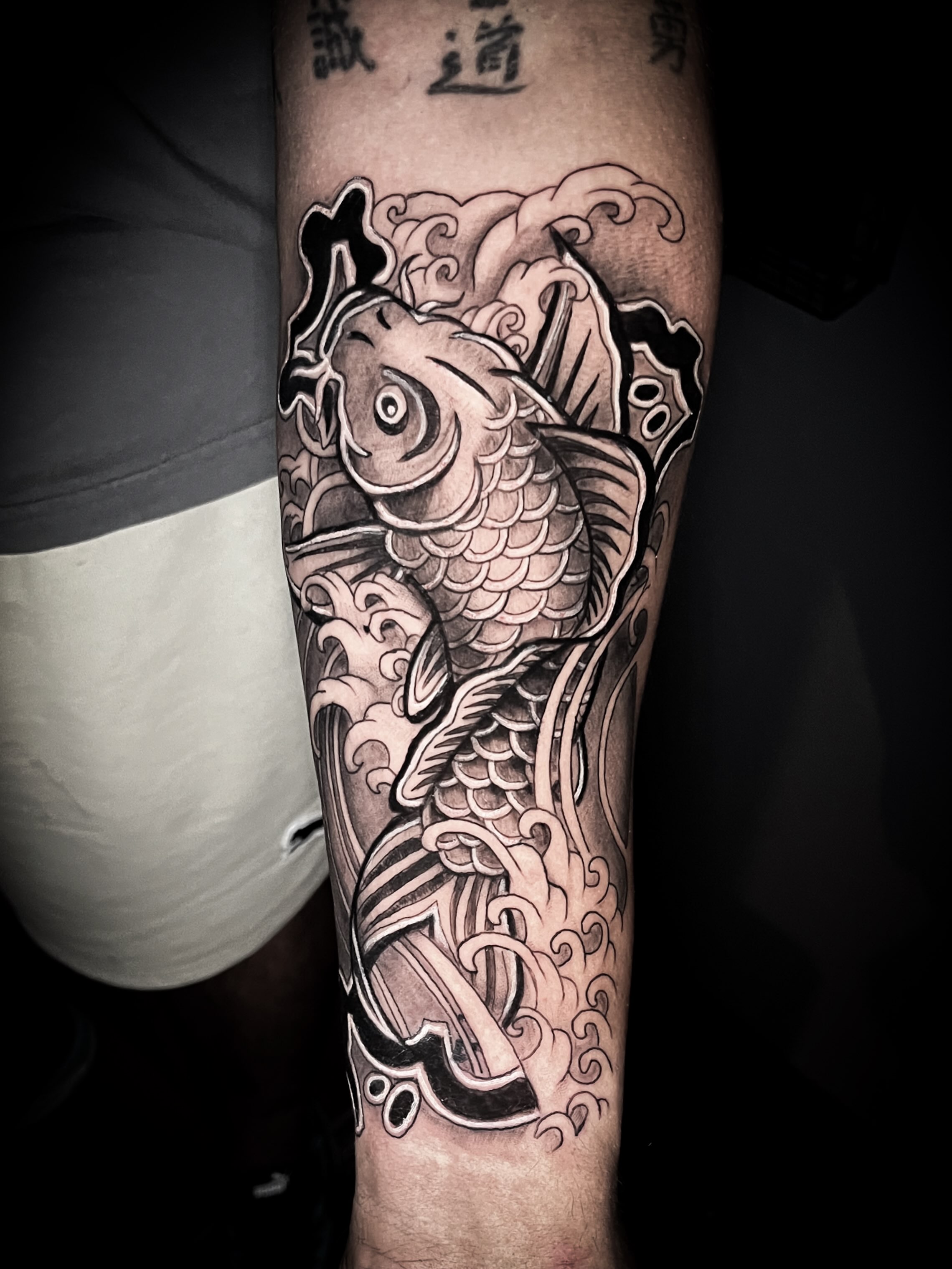 Koi fish japanese irezumi tattoo on the forearm by Lindsay Fernandez, Colorado Springs, Colorado