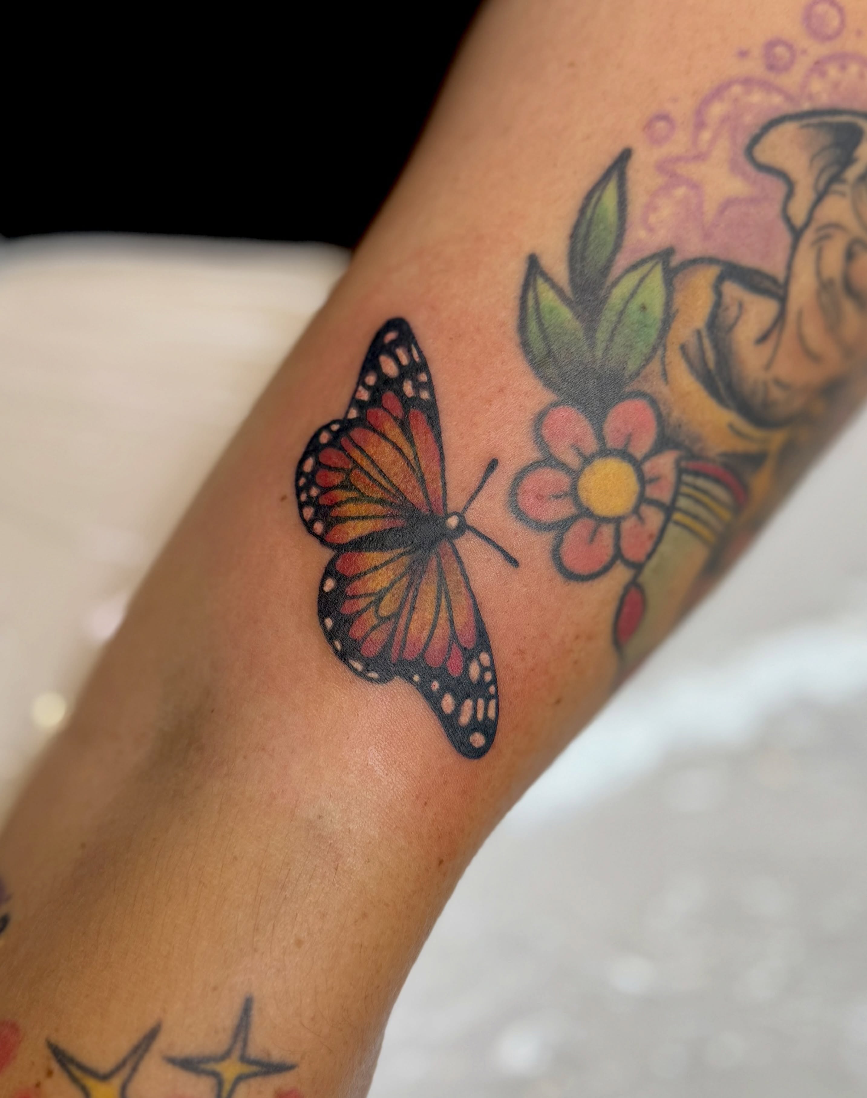 Butterfly new school tattoo on the forearm by Kyndall Lynn, Waxahachie, Texas