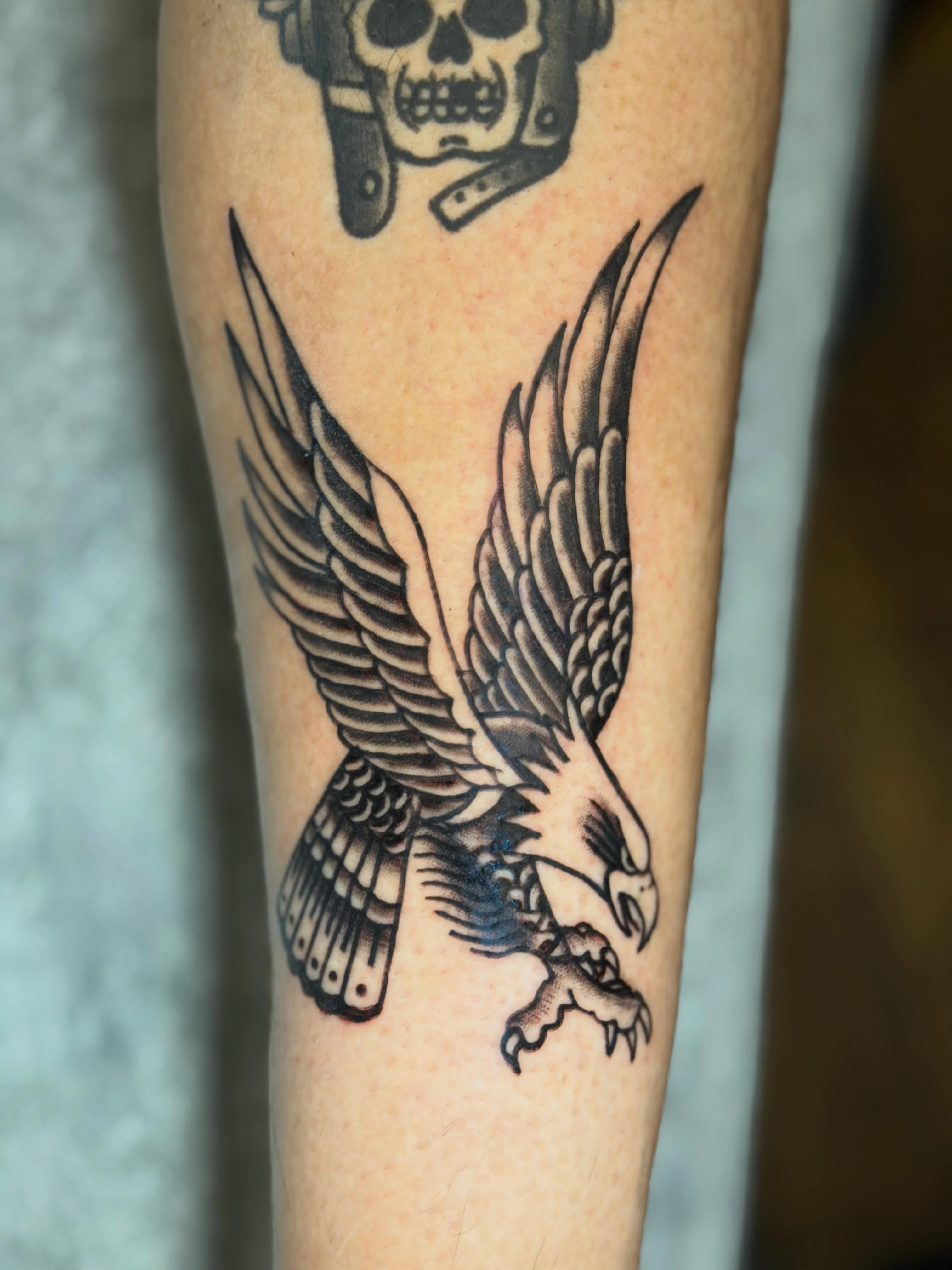 Eagle American traditional tattoo on the forearm by C.J.K. Roy