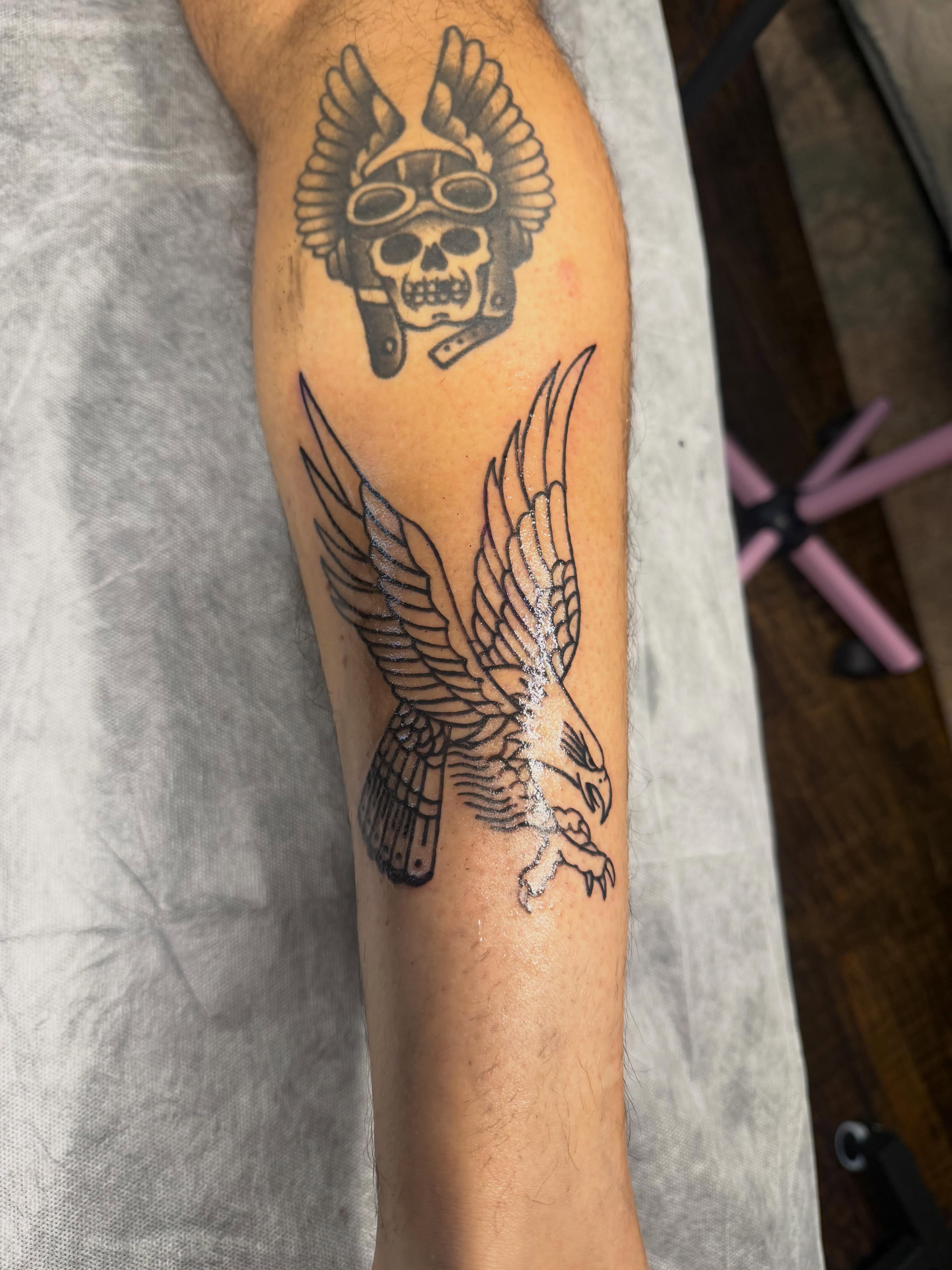 Eagle black and grey tattoo on the forearm by C.J.K. Roy