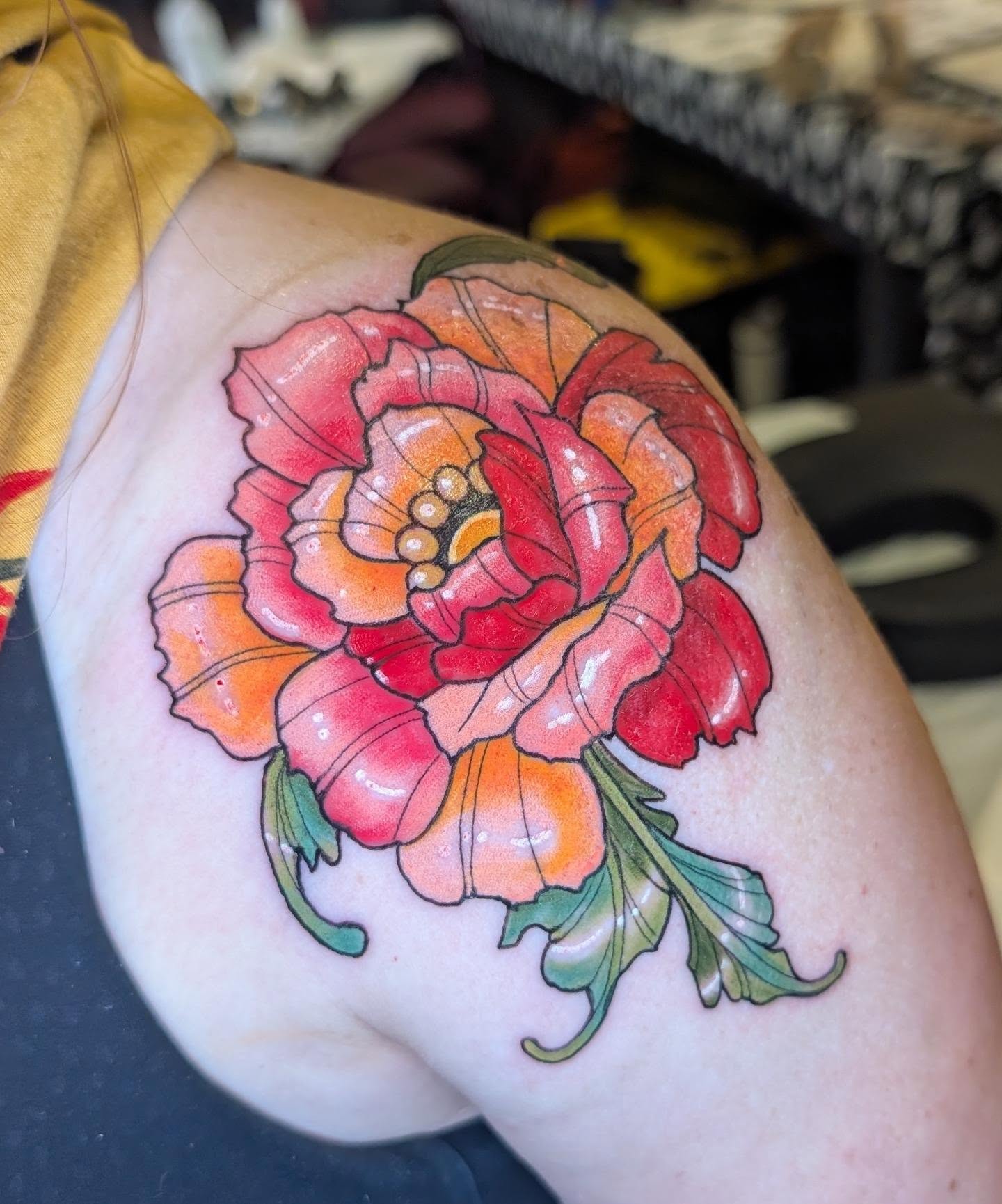 Peony American traditional tattoo on the shoulder by Michaela May