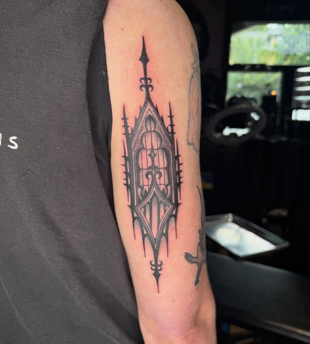 Gothic window black and grey tattoo on the forearm by Chloe Peters 🦭🦄🏳️‍🌈