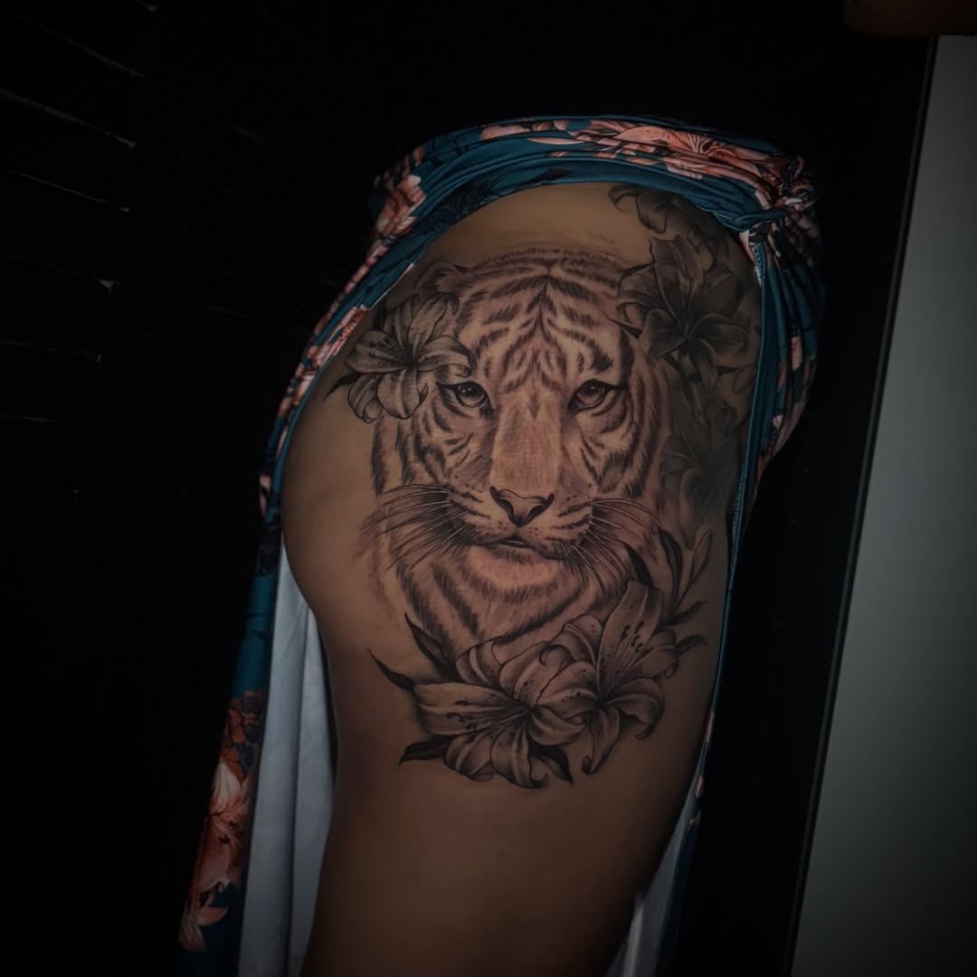 Tiger realism tattoo on the thigh by Sad Girl Tattoos