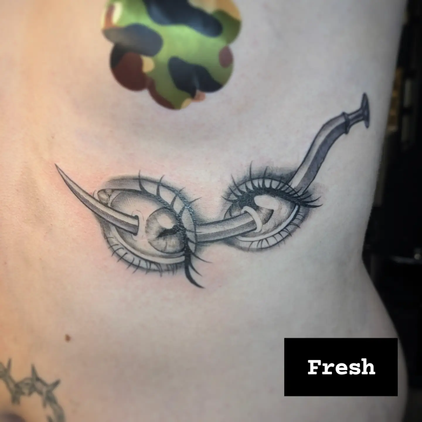 Eye with pipe realism tattoo on the chest by Jo Xylo - Minneapolis Tattoo Artist, Minneapolis, Minnesota